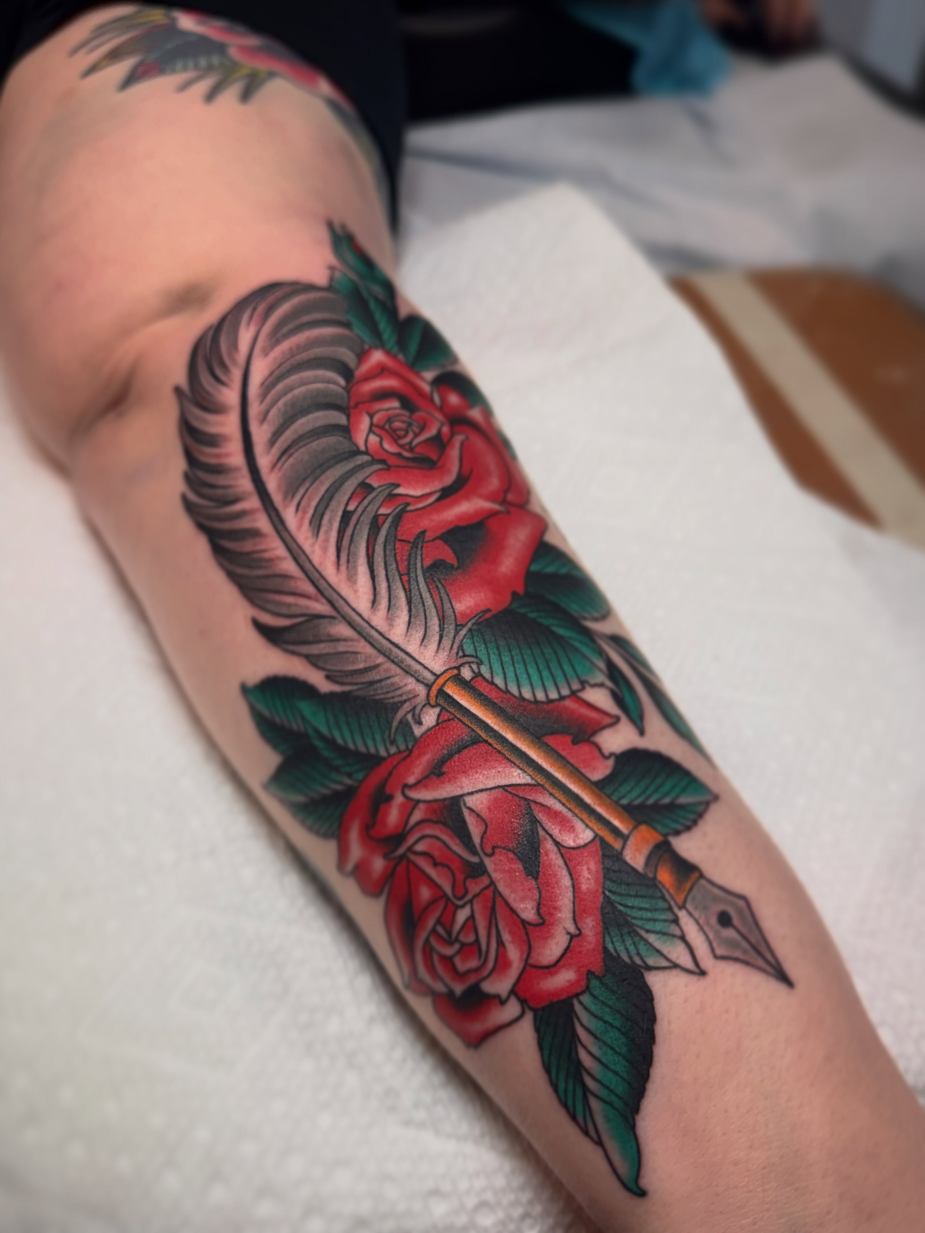 Pen and roses American traditional tattoo on the forearm by Cole Pittman Memphis Tattoo artist, Memphis, Tennessee