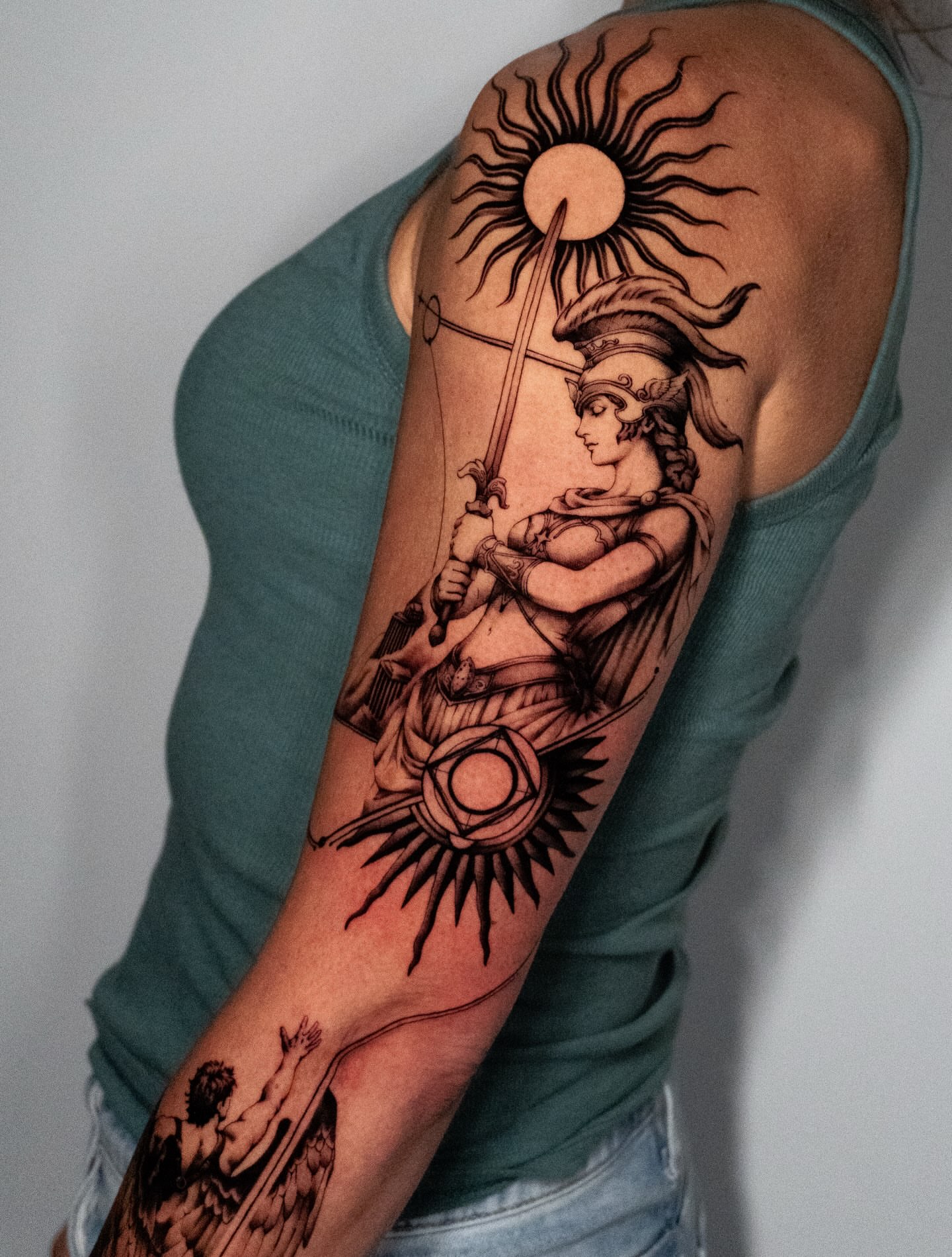 Warrior with sun black and grey tattoo on the upper arm by Moi Rivas, Salt Lake City, Utah