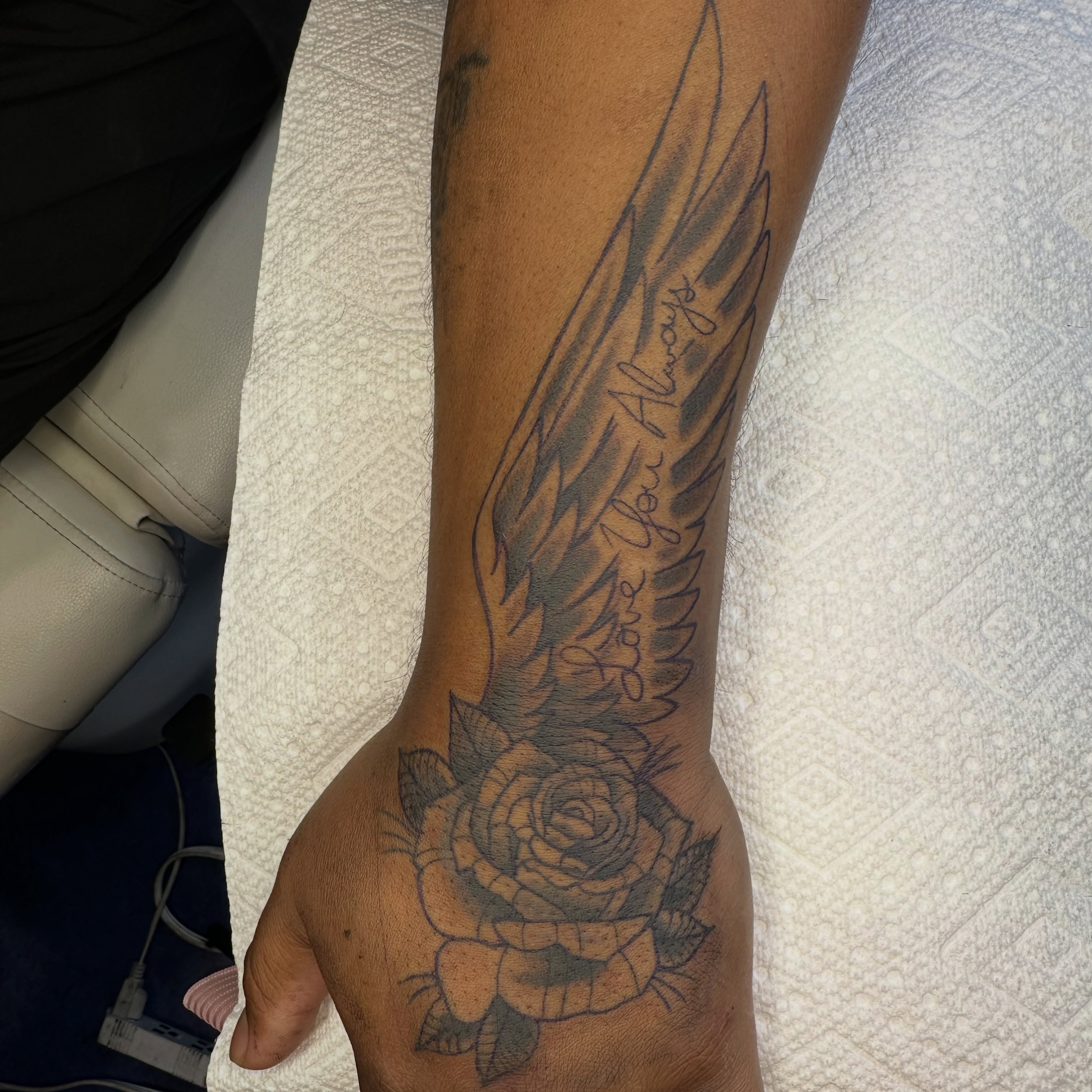 Wing and rose black and grey tattoo on the forearm by 🦷J.McHugh🦷