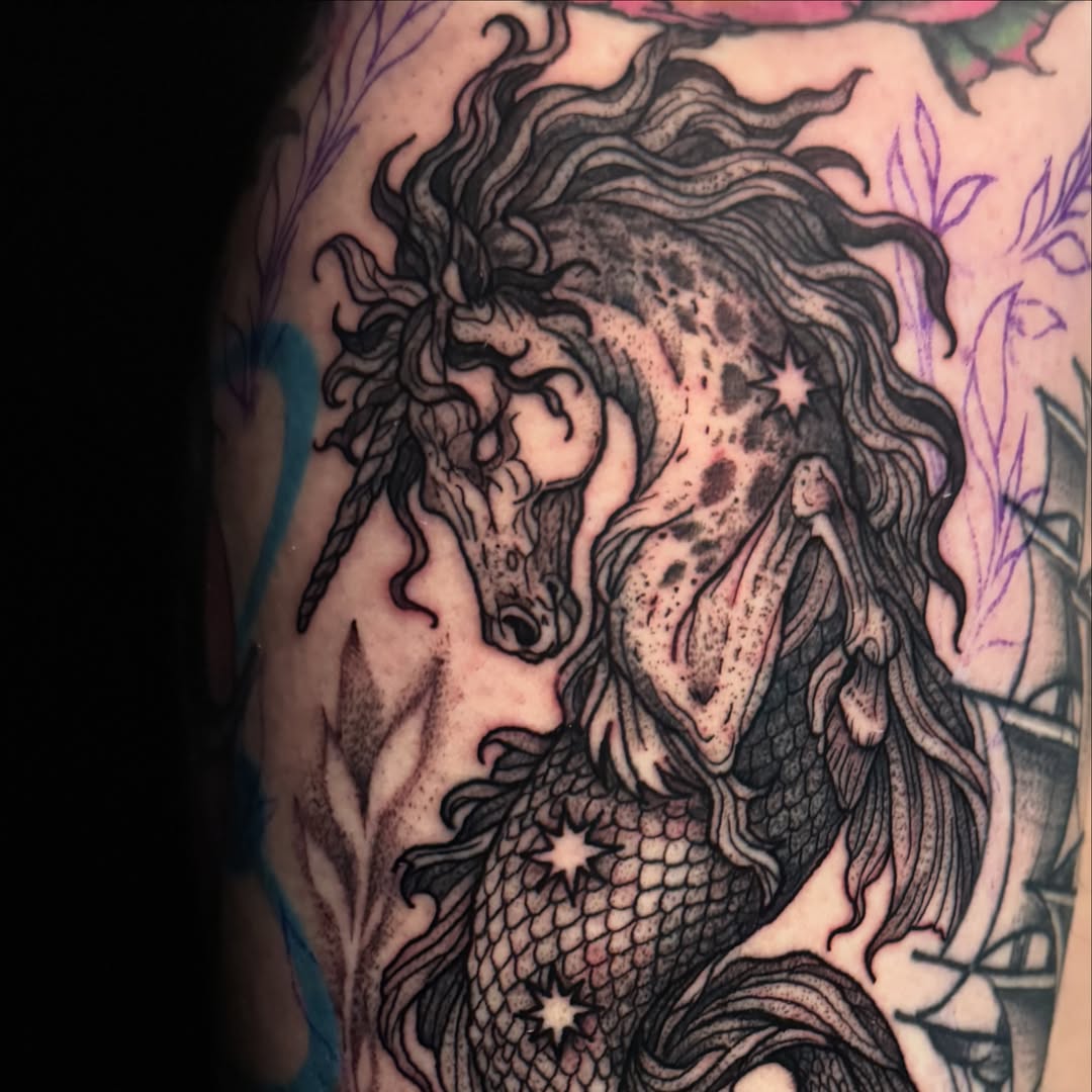 Mermaid dotwork tattoo on the upper arm by Brandiane Wells