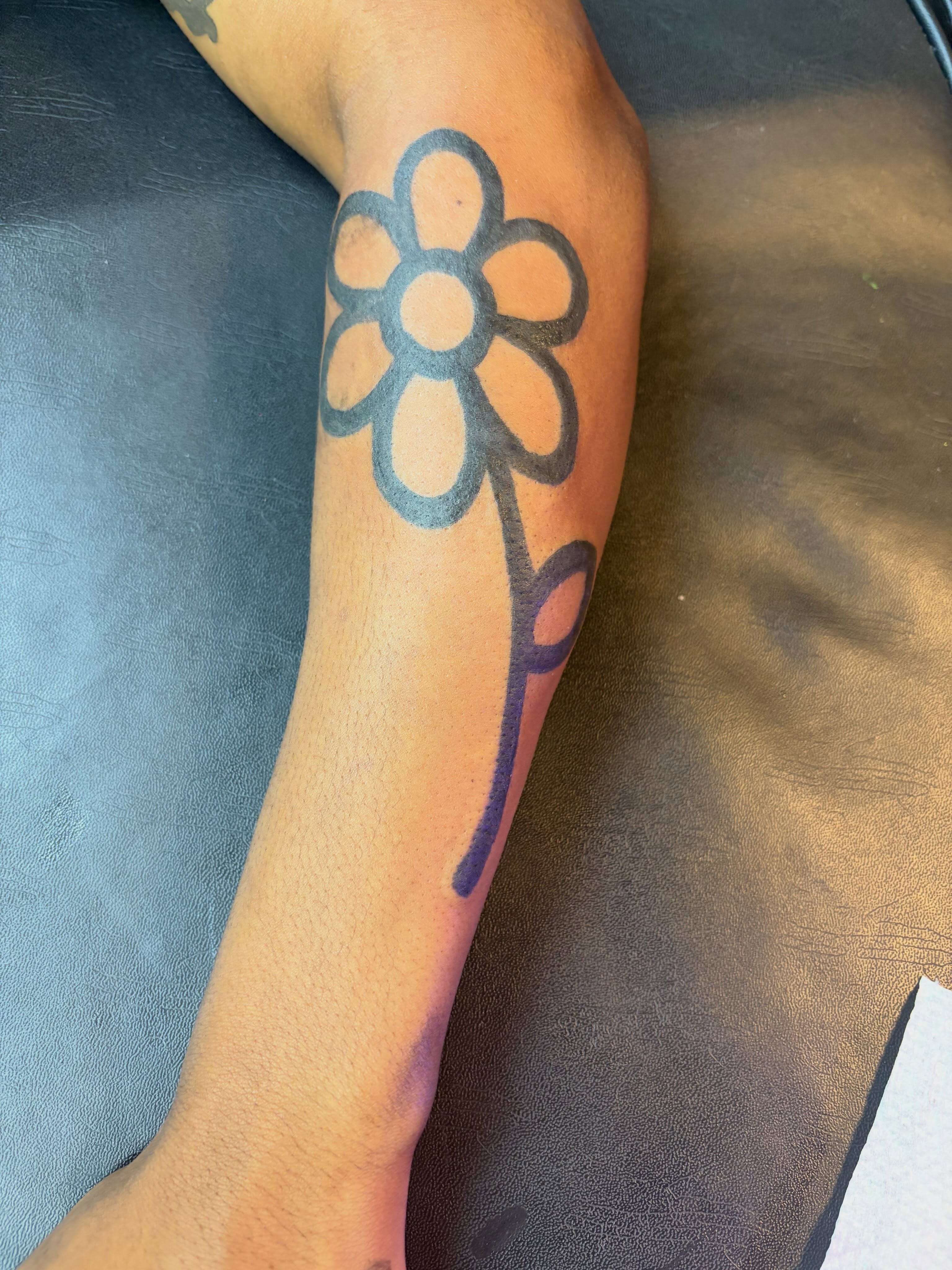 Flower black and grey tattoo on the forearm by Madison