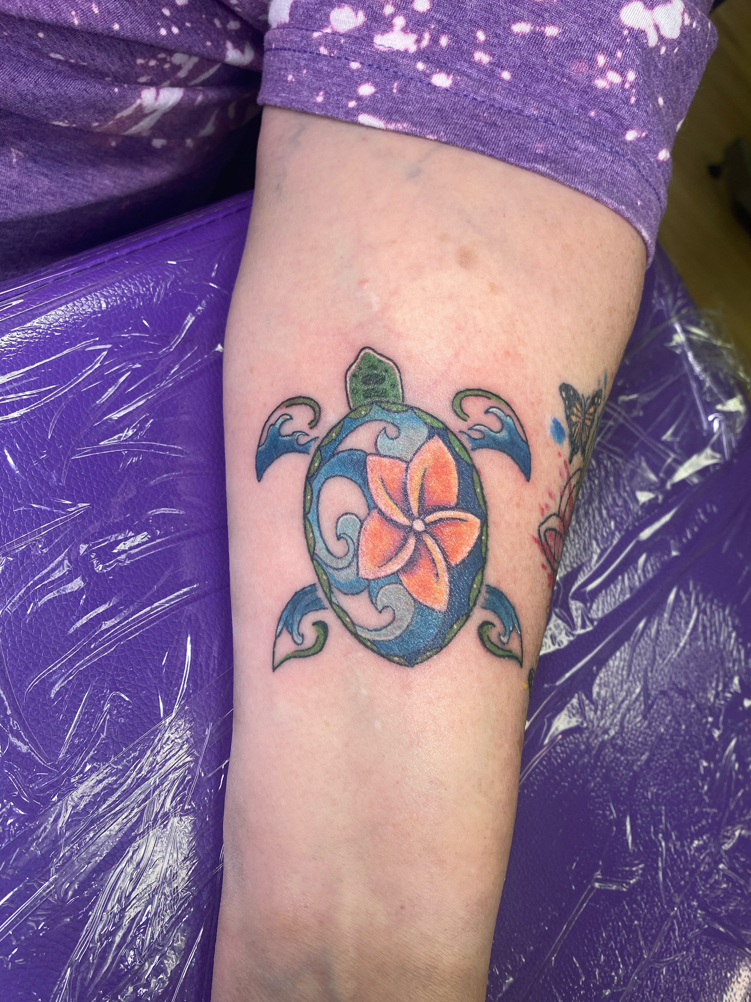 Plumeria turtle new school tattoo on the forearm by Katie Leeper