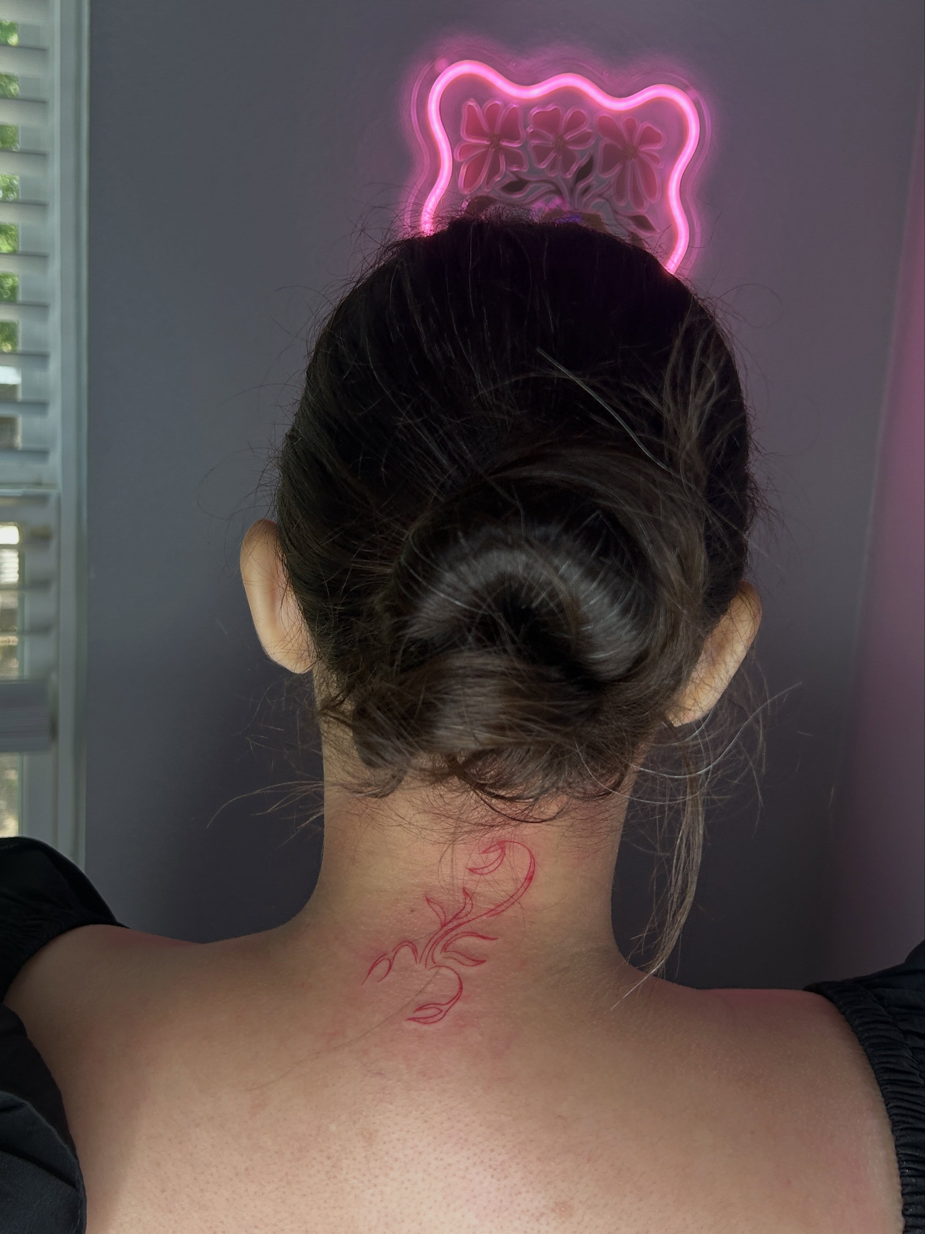 Floral design fine line tattoo on the neck by @tattoosbyskyeee