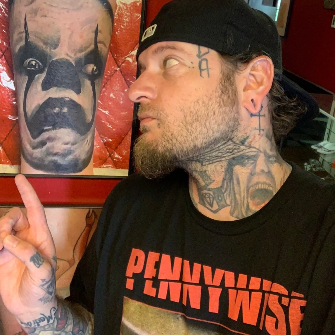 Clown face realism tattoo on the forearm by Vudu Tattooer