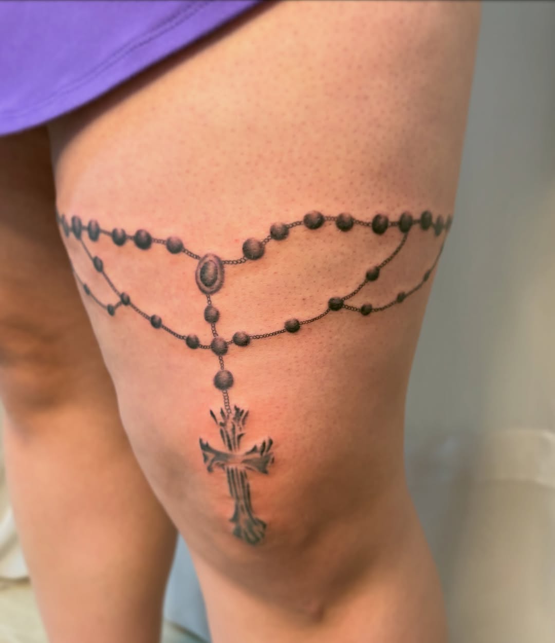 Rosary black and grey tattoo on the thigh by Jackie π€