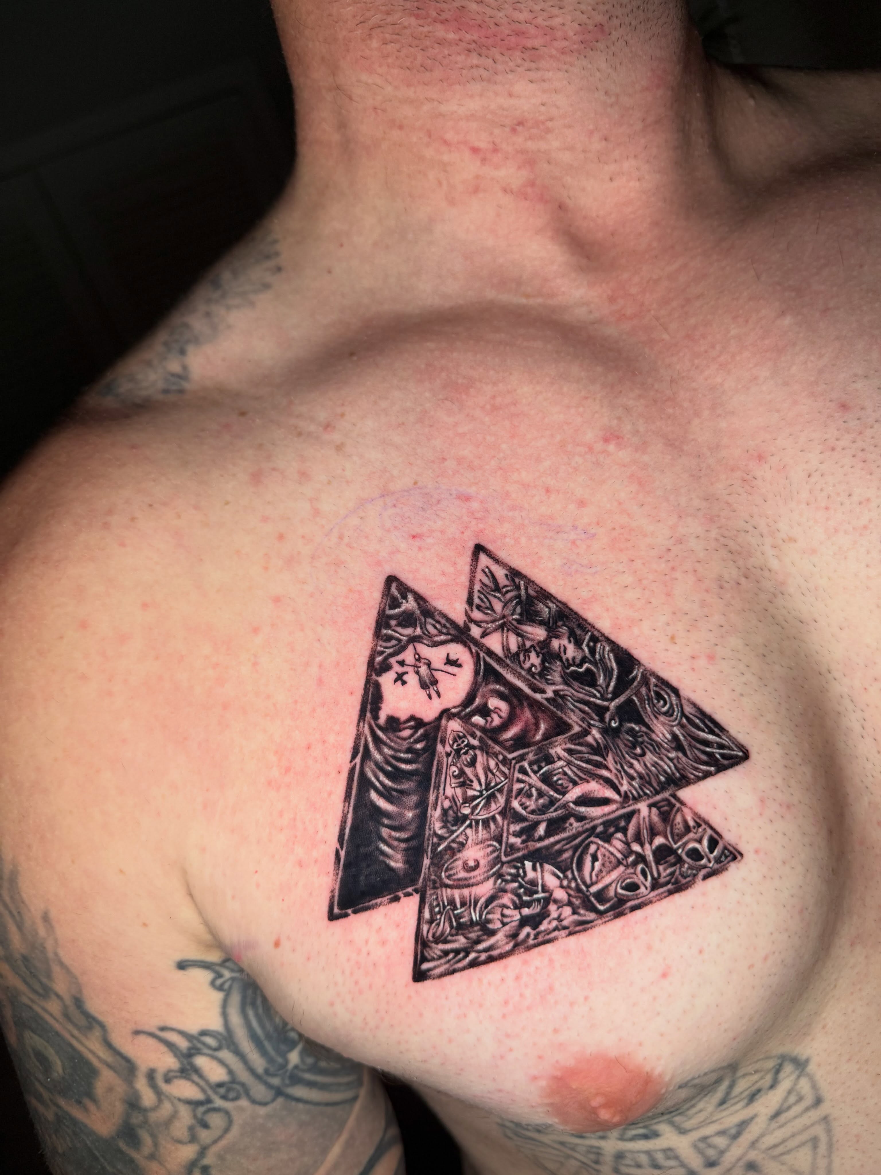 Triangle with woman geometric tattoo on the chest by Steve - Tattoo Artist