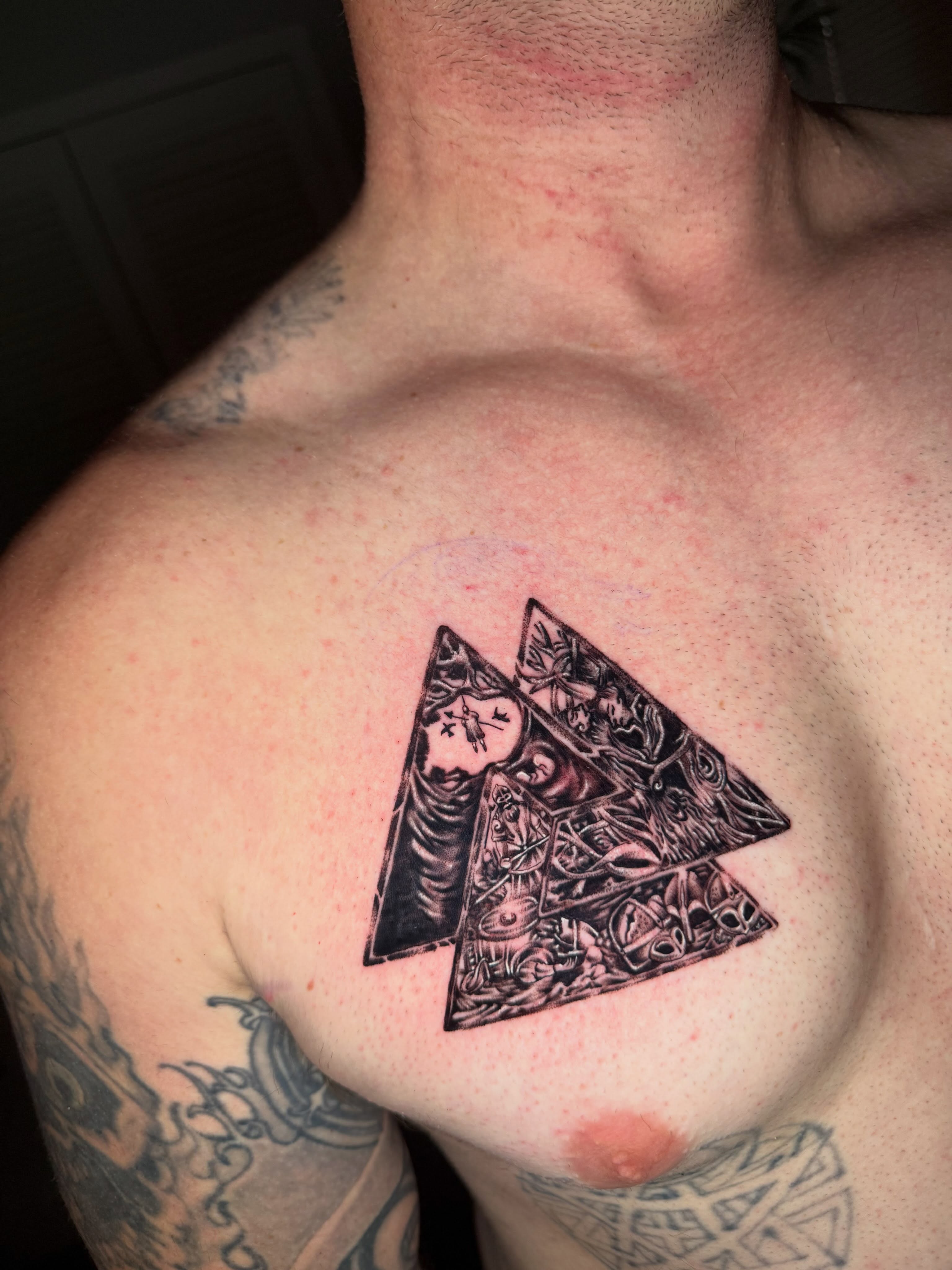 Triangle with intricate design geometric tattoo on the chest by Steve - Tattoo Artist