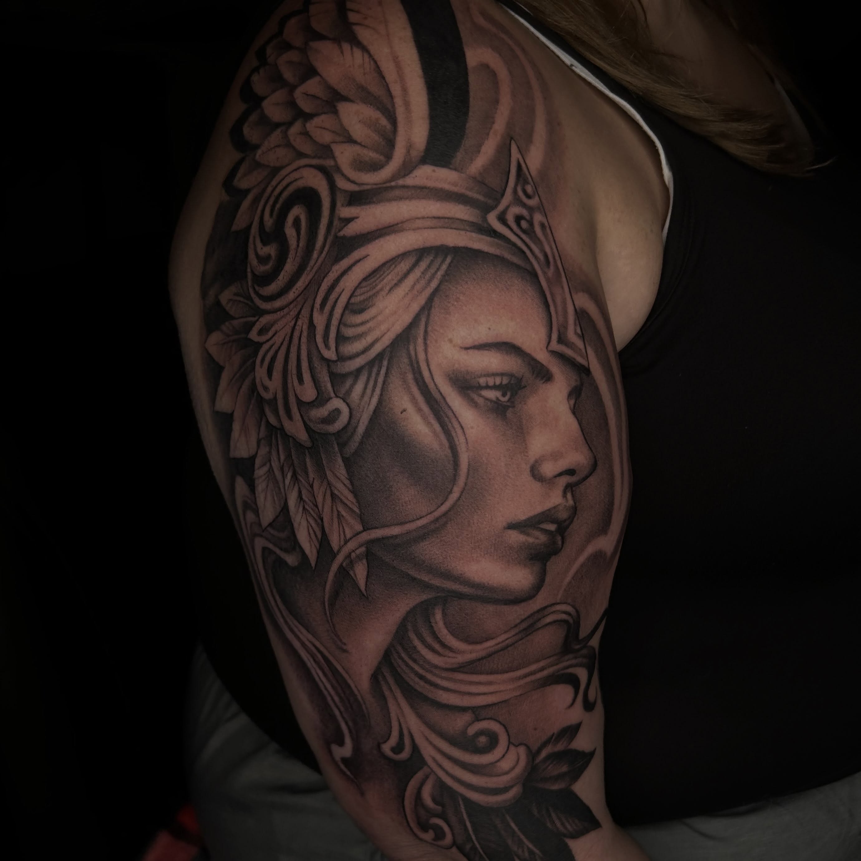 Woman's profile realism tattoo on the shoulder by Whitney Harbin