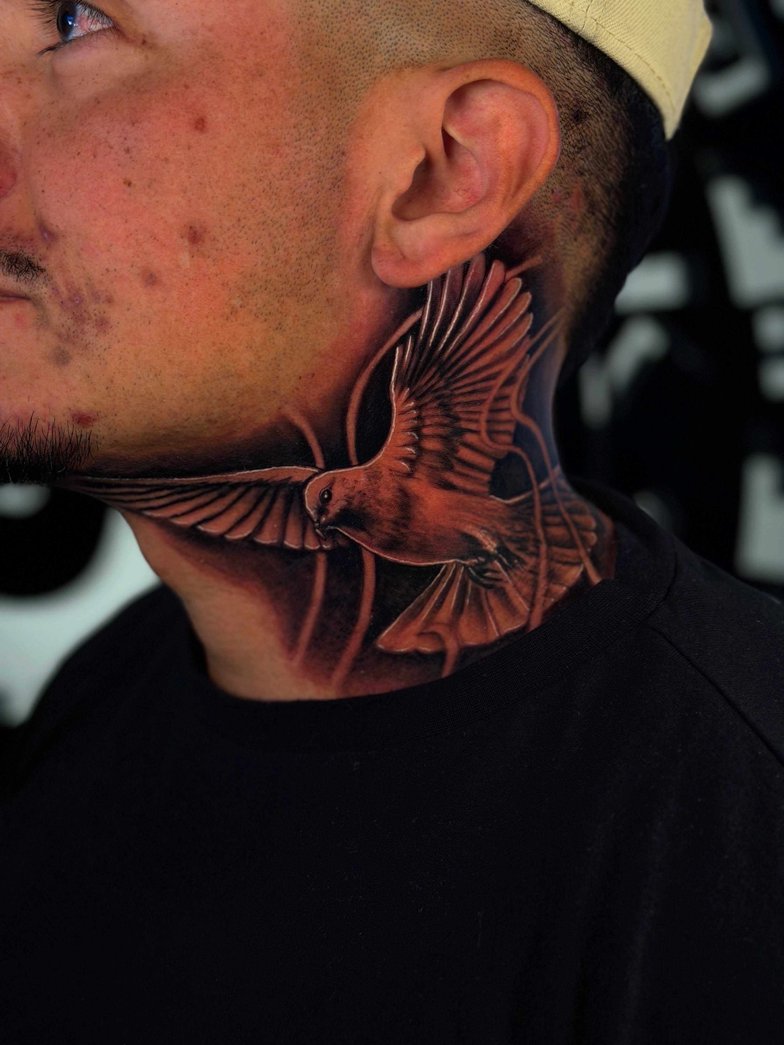Bird realism tattoo on the neck by Dreamchaserink