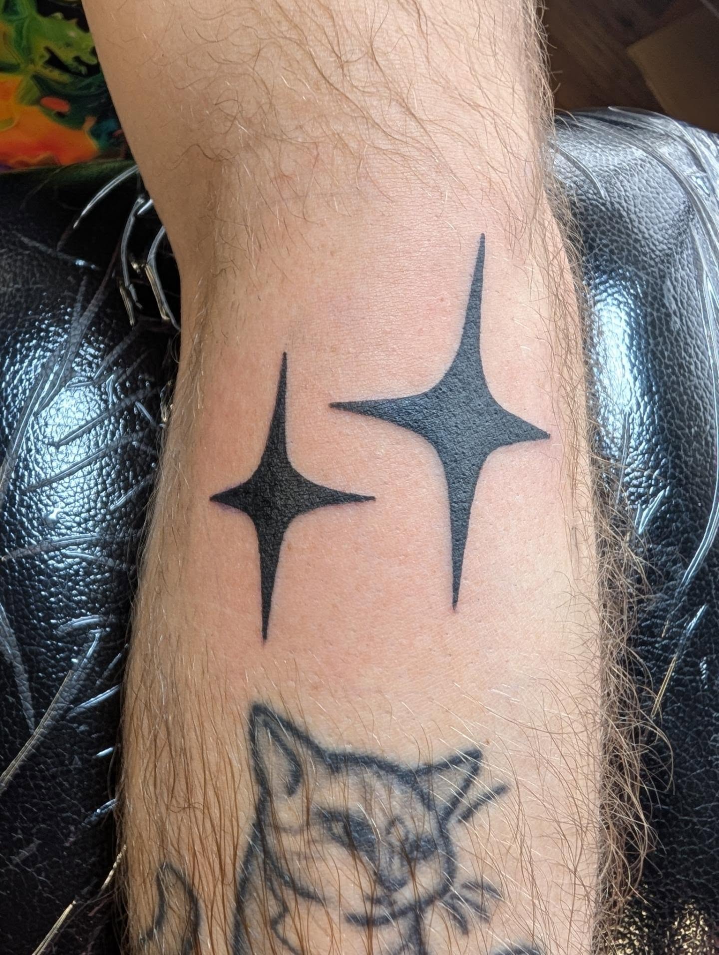 Stars black and grey tattoo on the forearm by Chad Nuber