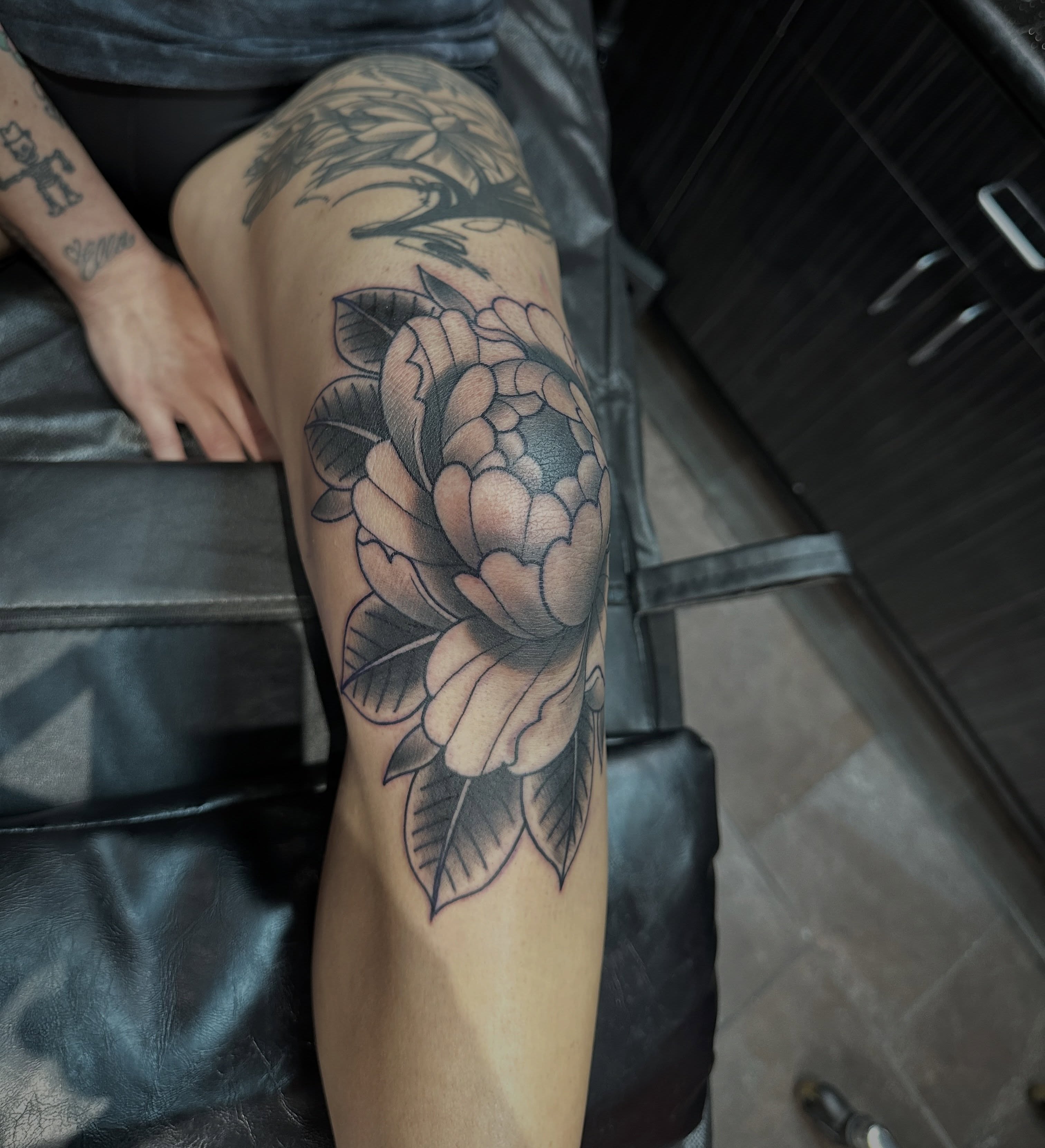 Peony American traditional tattoo on the thigh by Walk-in American Traditional Tattoos Las