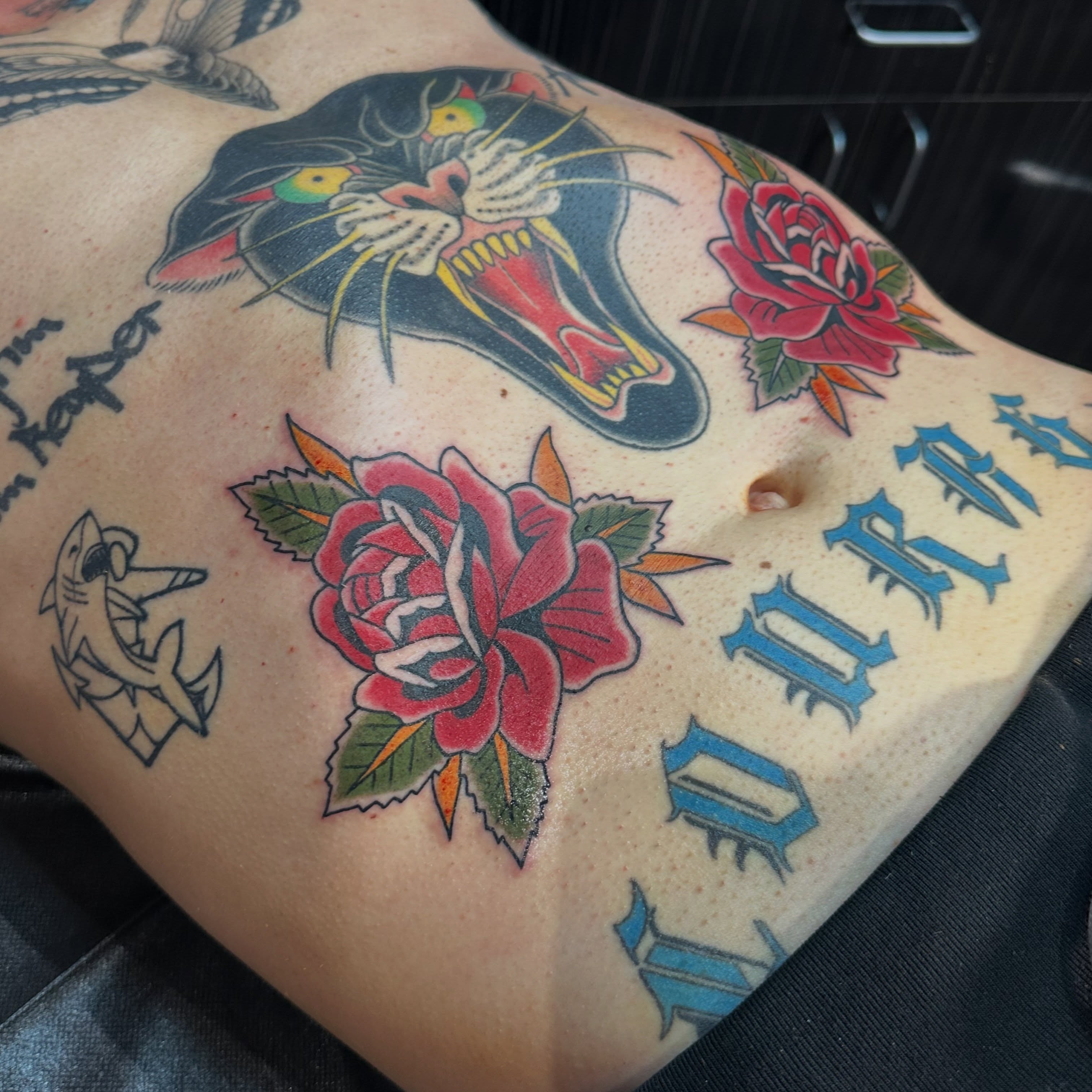 Panther and roses American traditional tattoo on the thigh by Walk-in American Traditional Tattoos Las