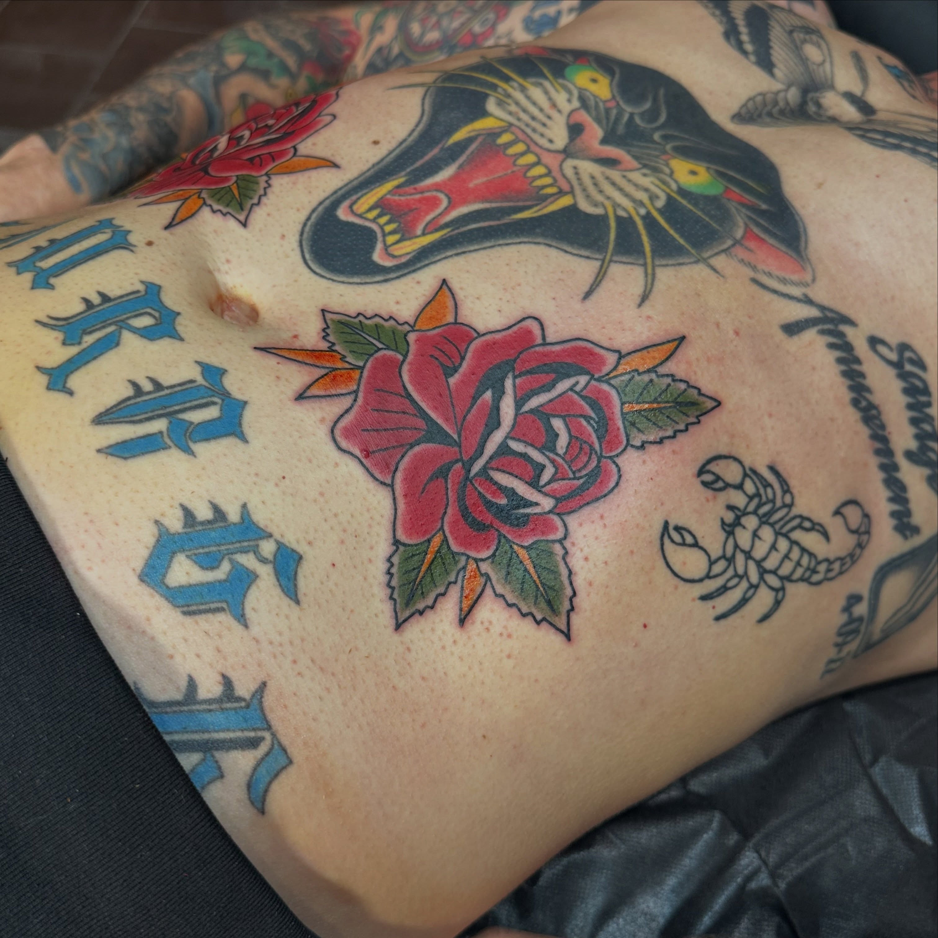 Panther, rose, scorpion American traditional tattoo on the torso by Walk-in American Traditional Tattoos Las