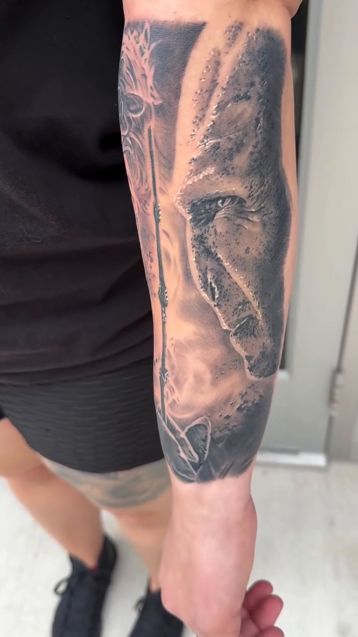 Lion and wizard realism tattoo by Steve Bishov