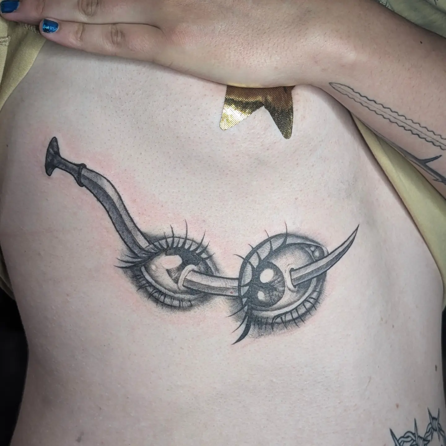 Eye with sword realism tattoo on the chest by Jo Xylo - Minneapolis Tattoo Artist, Minneapolis, Minnesota
