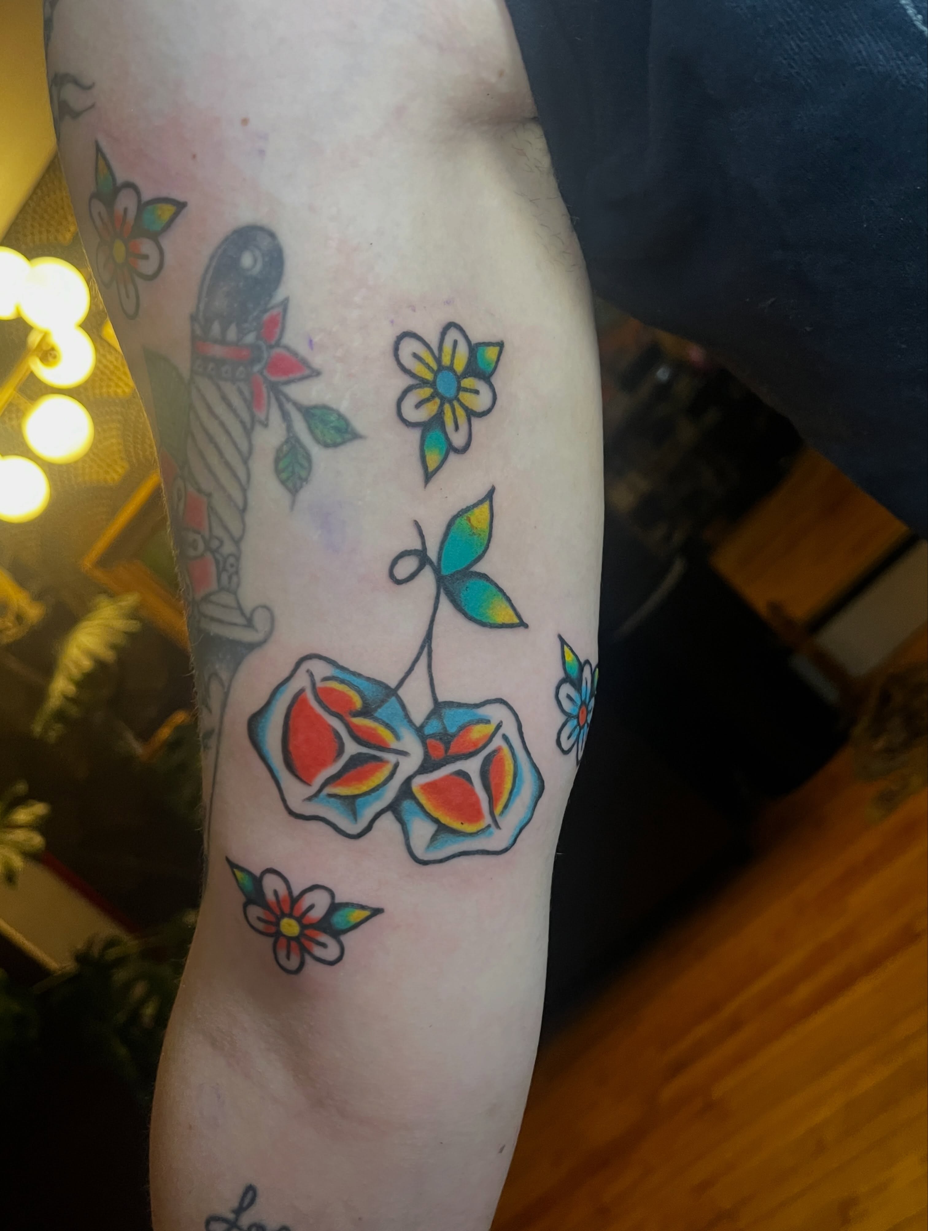 Cherry and flowers new school tattoo on the forearm by madelynne (maddie) caldwell tattoos
