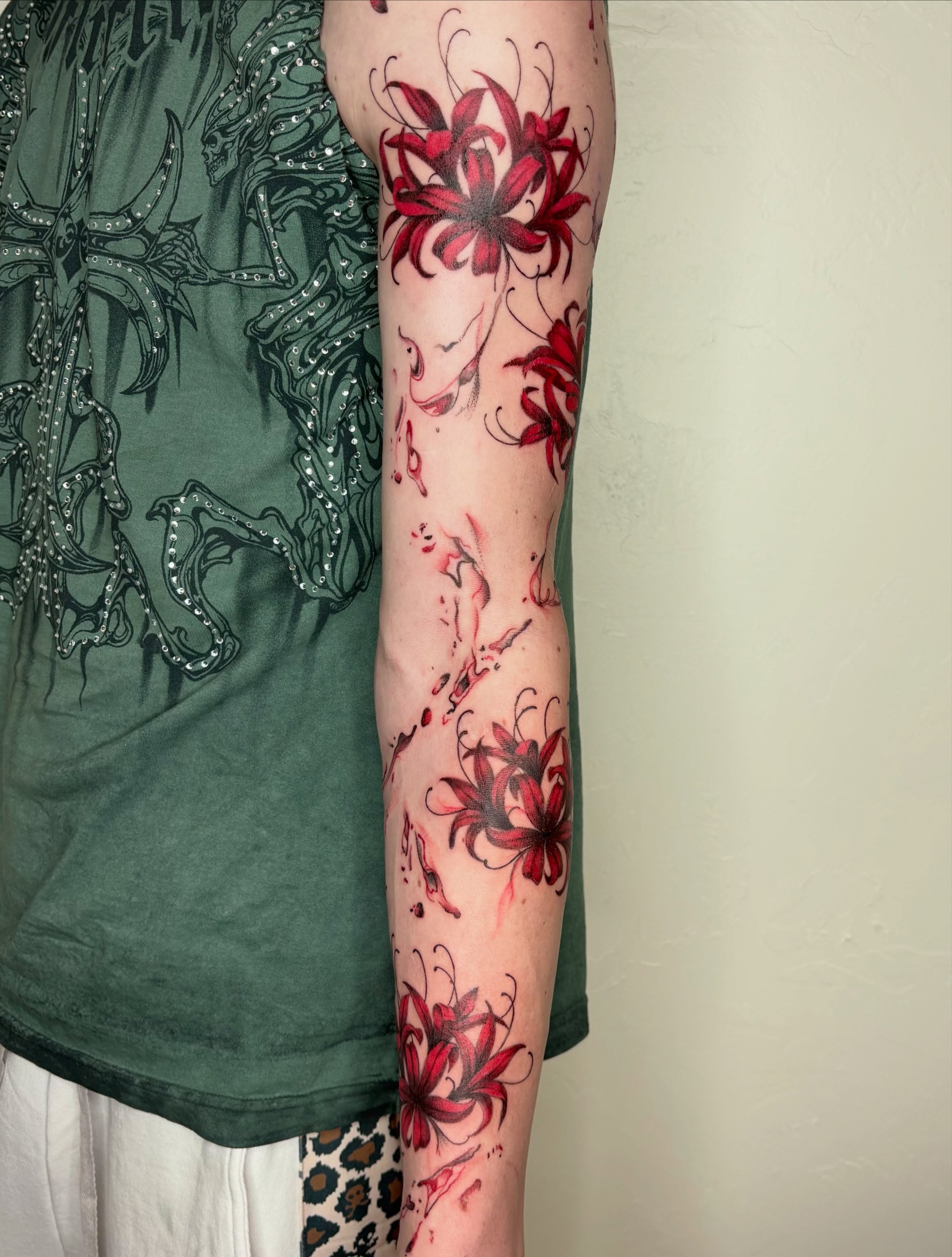 Chrysanthemum watercolor tattoo on the forearm by Sierra Maynard
