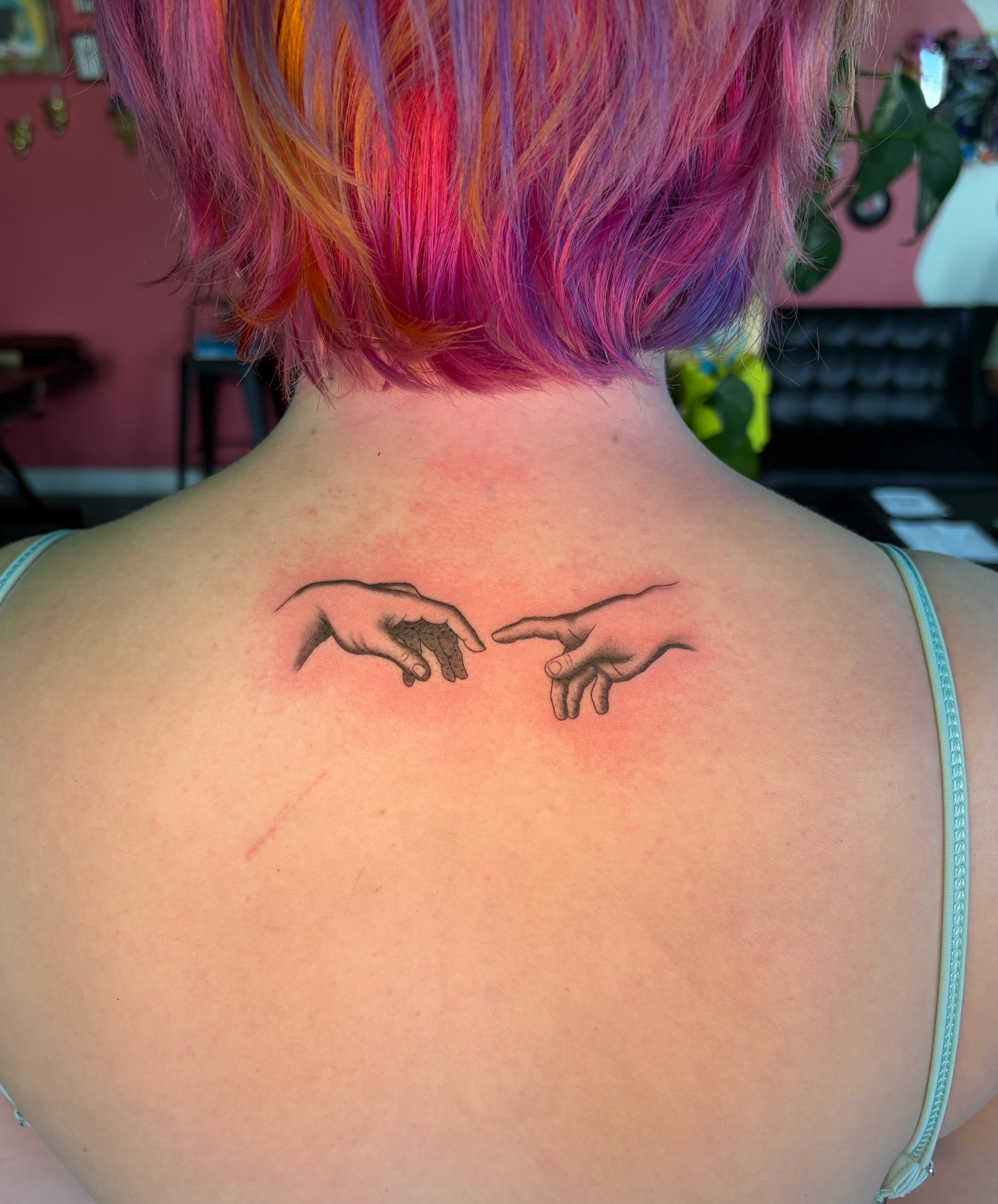 Hands black and grey tattoo on the back by Daniela