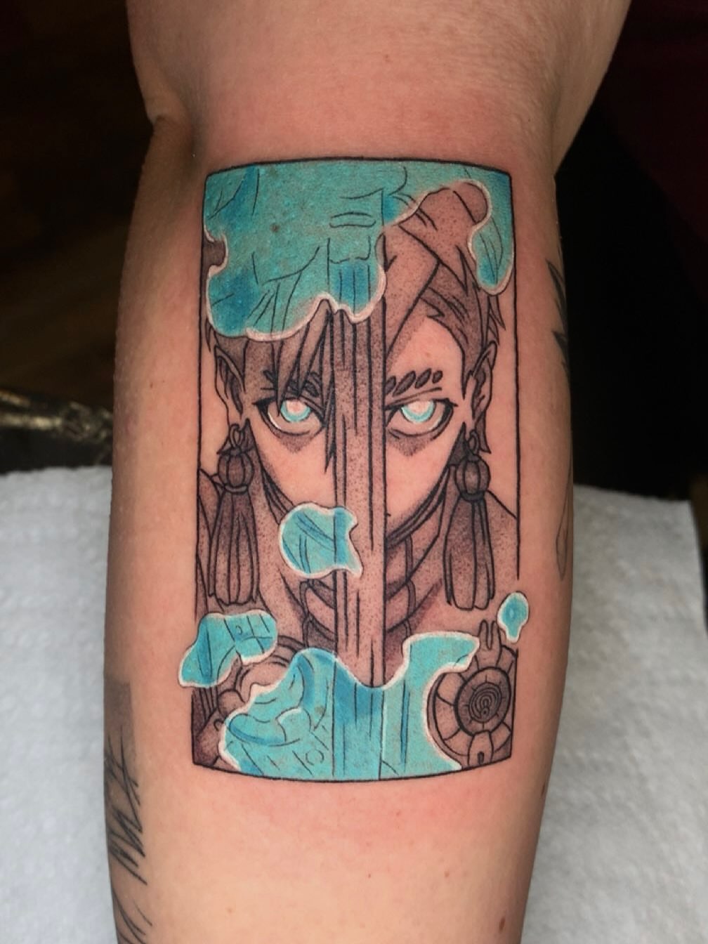 Anime character anime tattoo on the forearm by Maddie Rees