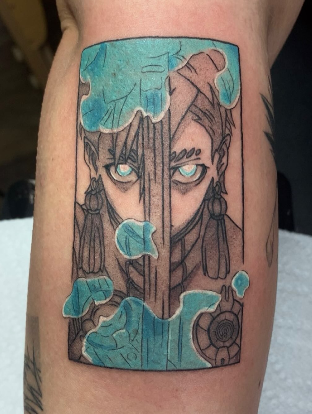 Elf-like figure anime tattoo on the forearm by Maddie Rees