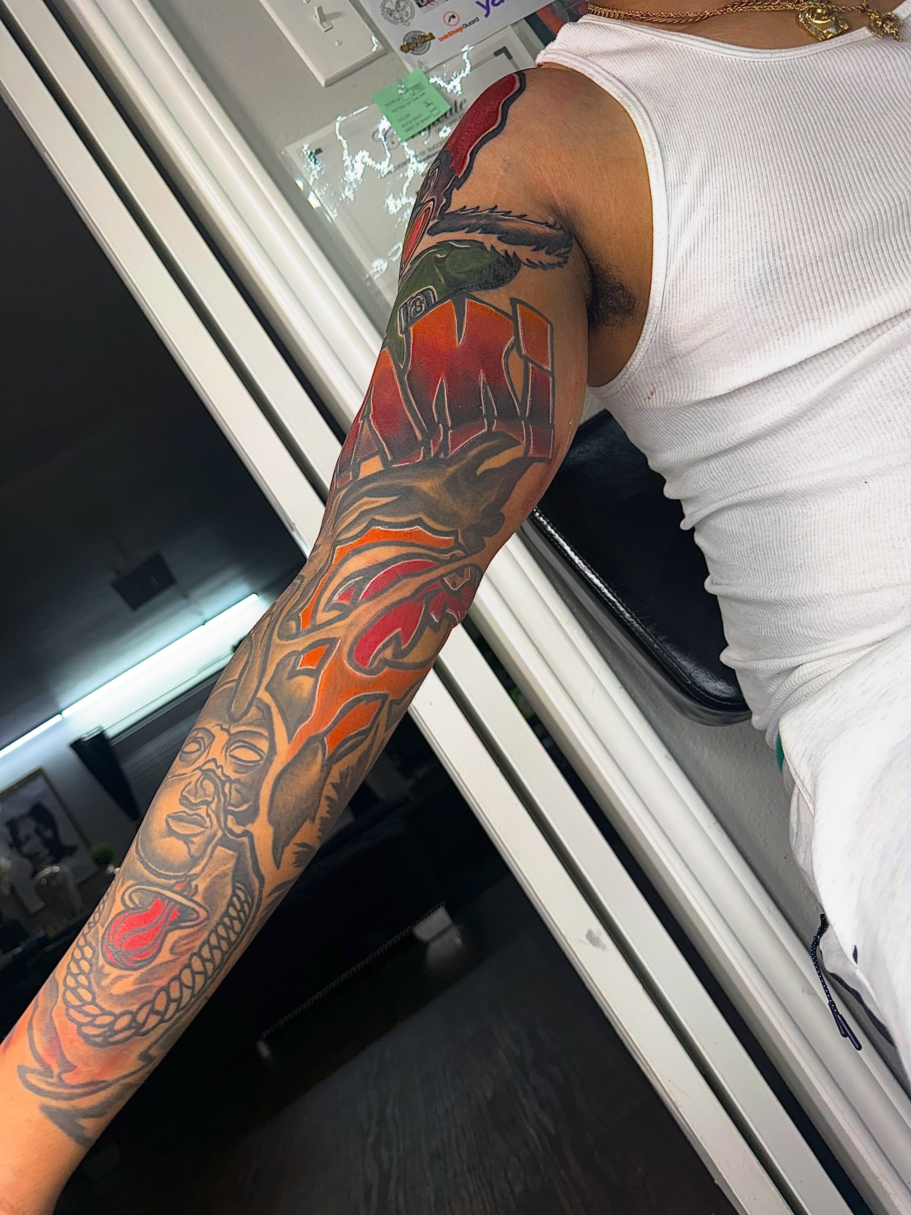 Sailboat and flame American traditional tattoo on the forearm by Deonte Dwayne Durham