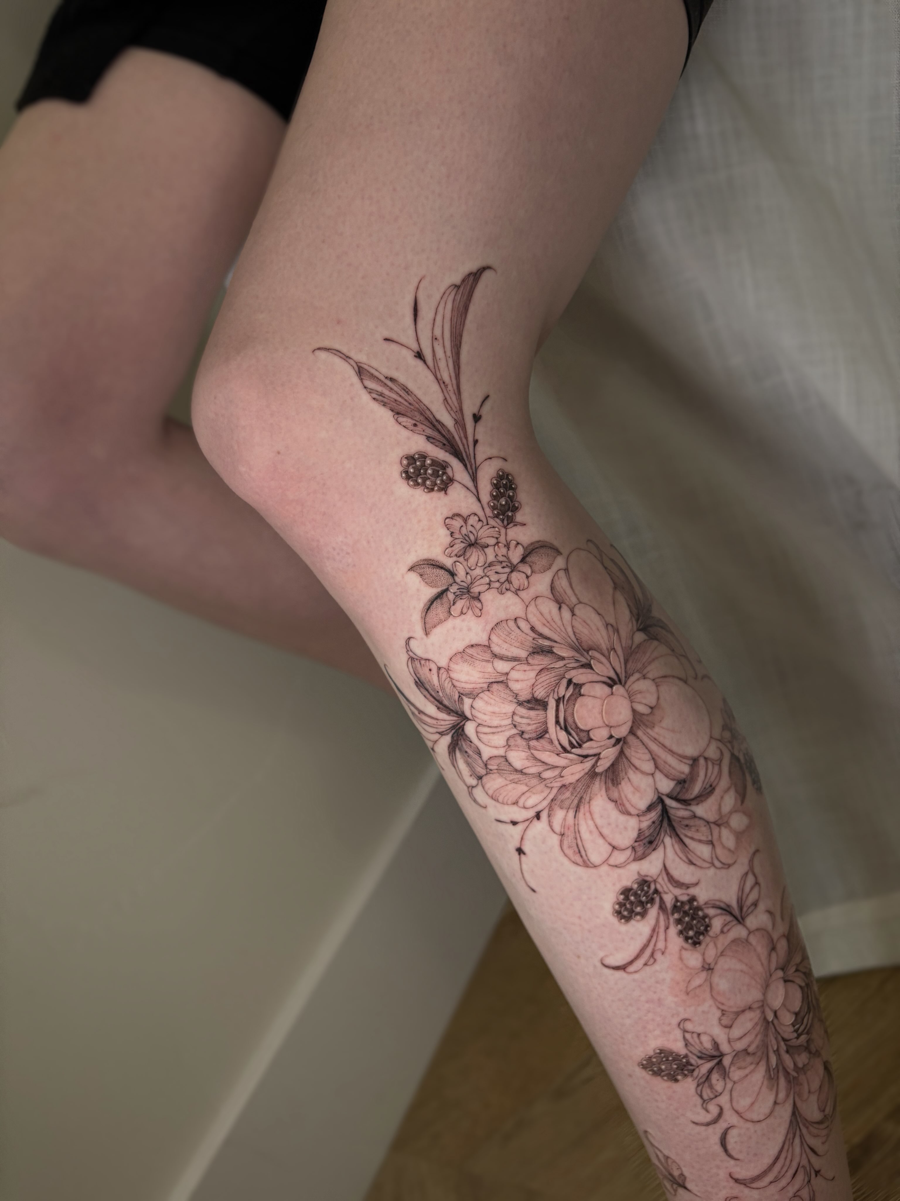 Floral arrangement black and grey tattoo on the forearm by Justene Renee 🖤 Fine Line Tattoo Artist