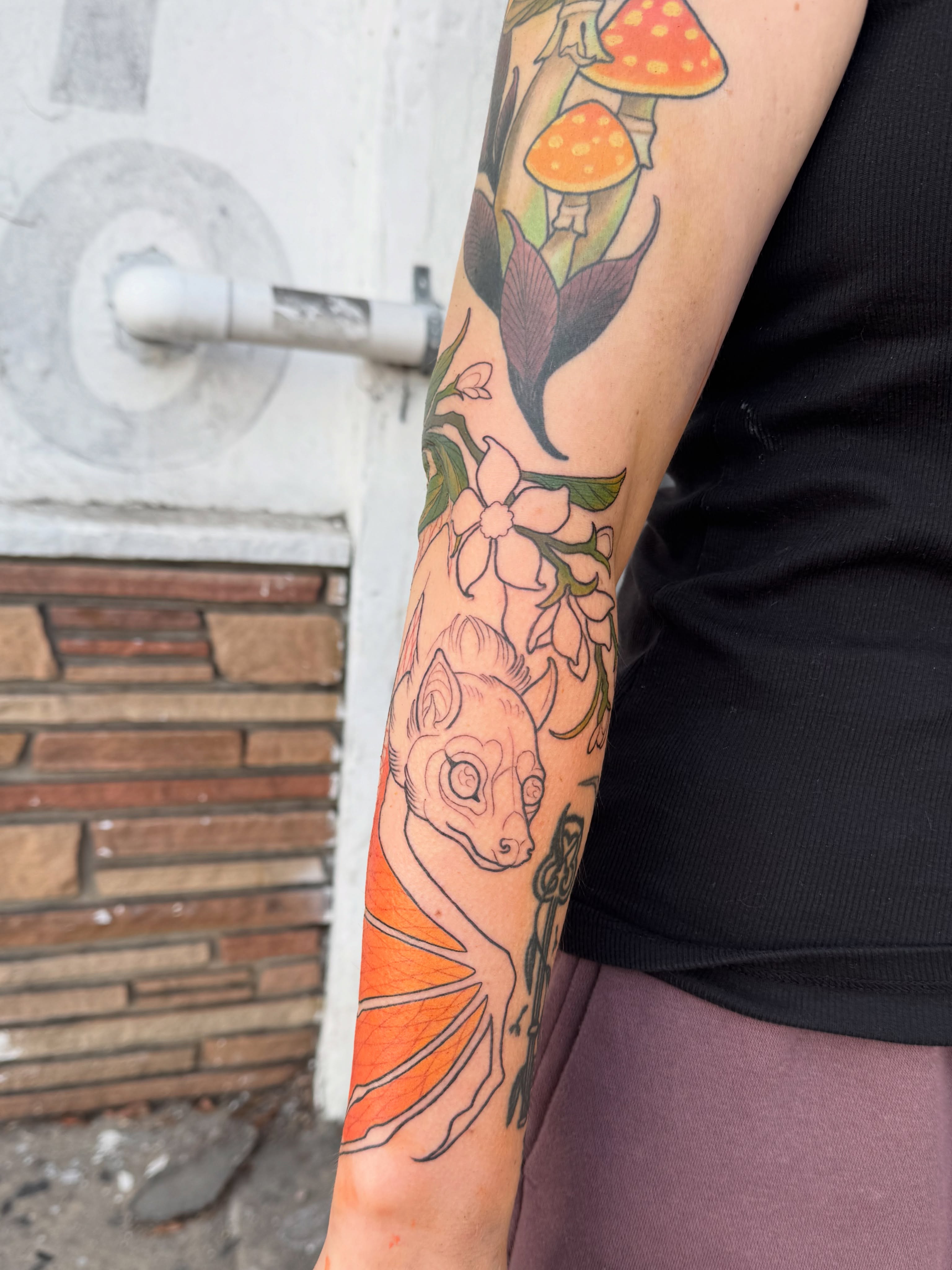 Lemur and flowers new school tattoo on the forearm by Andi Fitz ✨ San Diego Tattoo Artist, San Diego, California