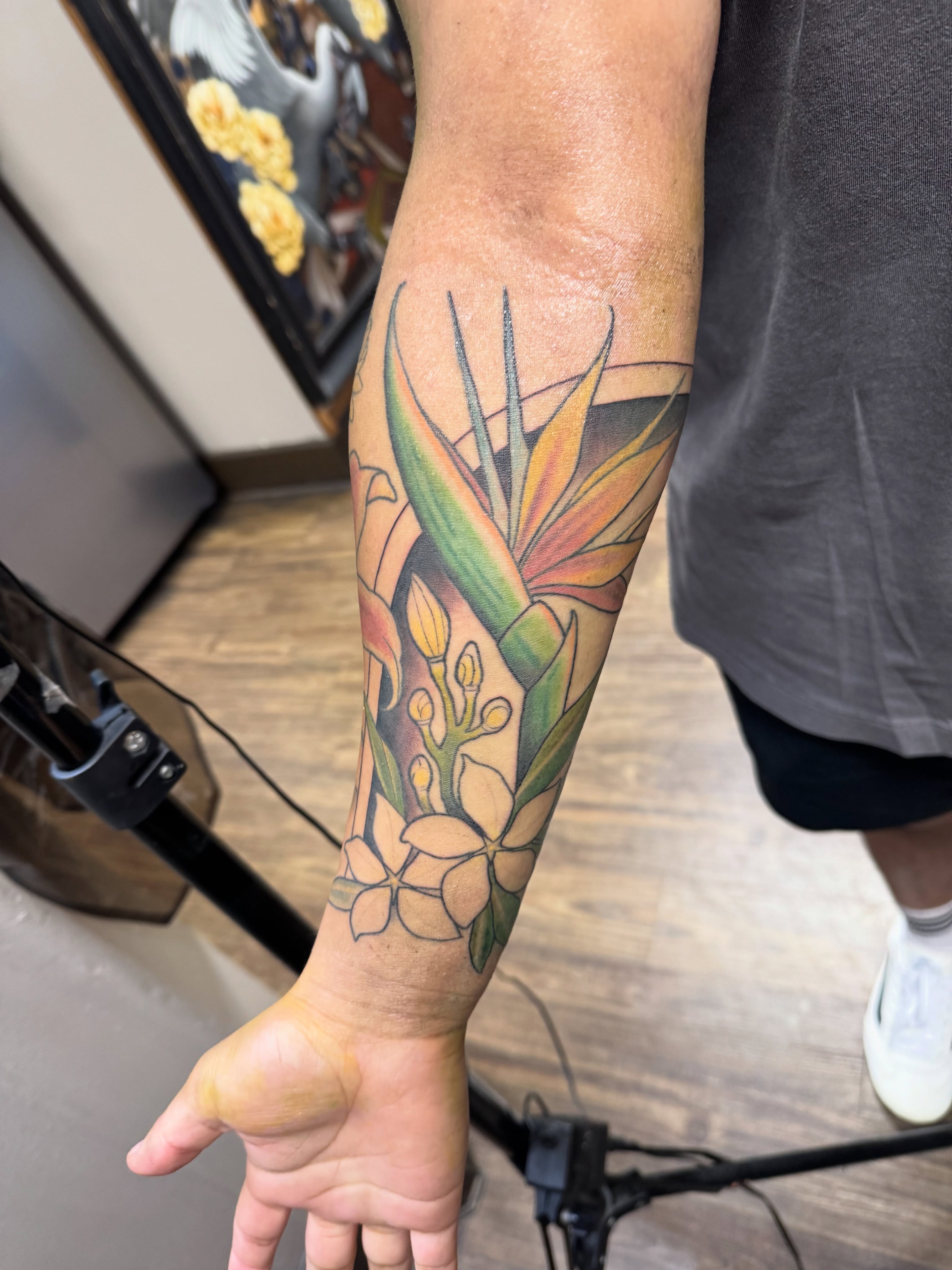 Bird of paradise and flowers realism tattoo on the forearm by Andi Fitz ✨ San Diego Tattoo Artist, San Diego, California