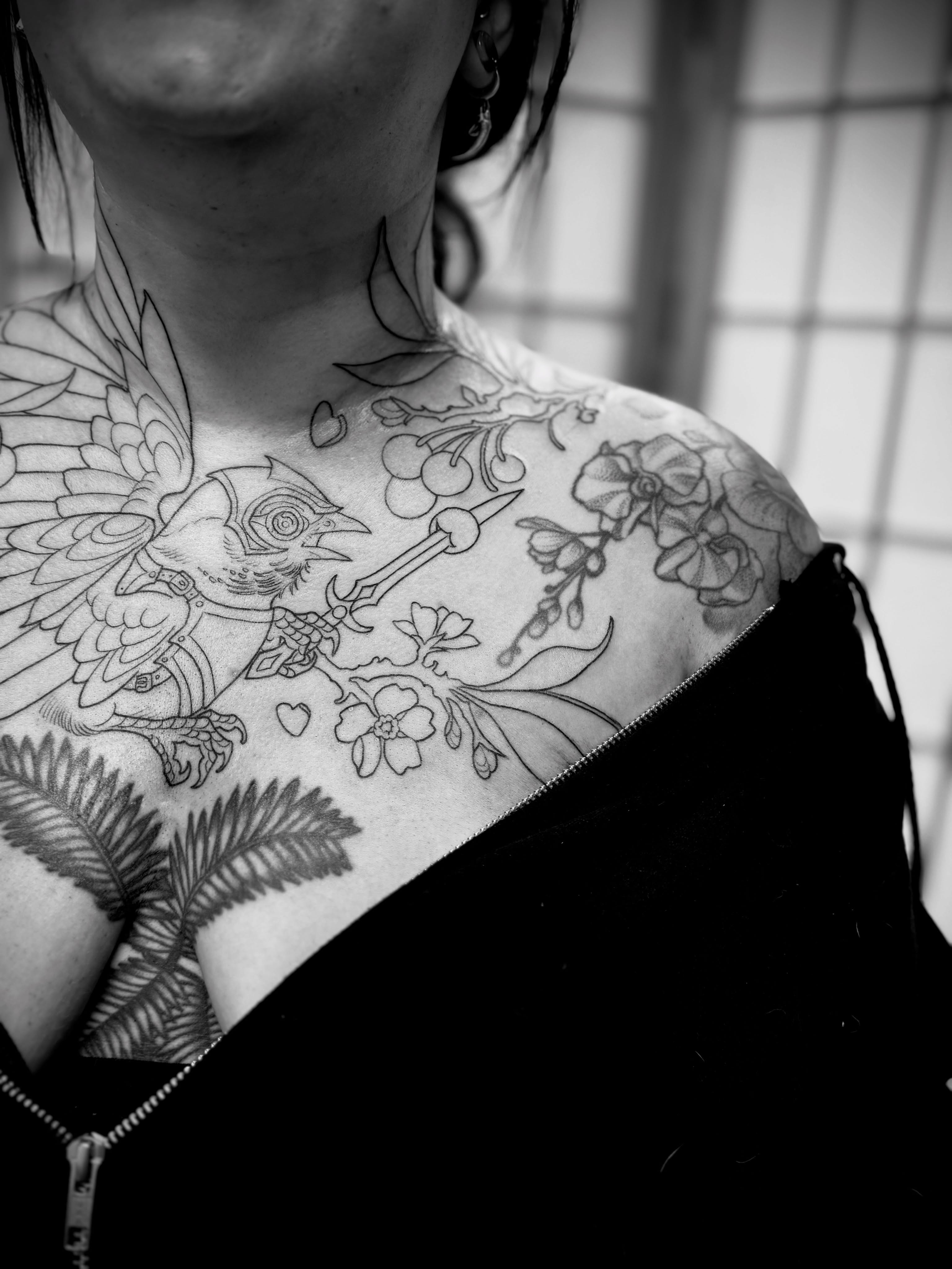 Bird and floral black and grey tattoo on the chest by Andi Fitz ✨ San Diego Tattoo Artist, San Diego, California