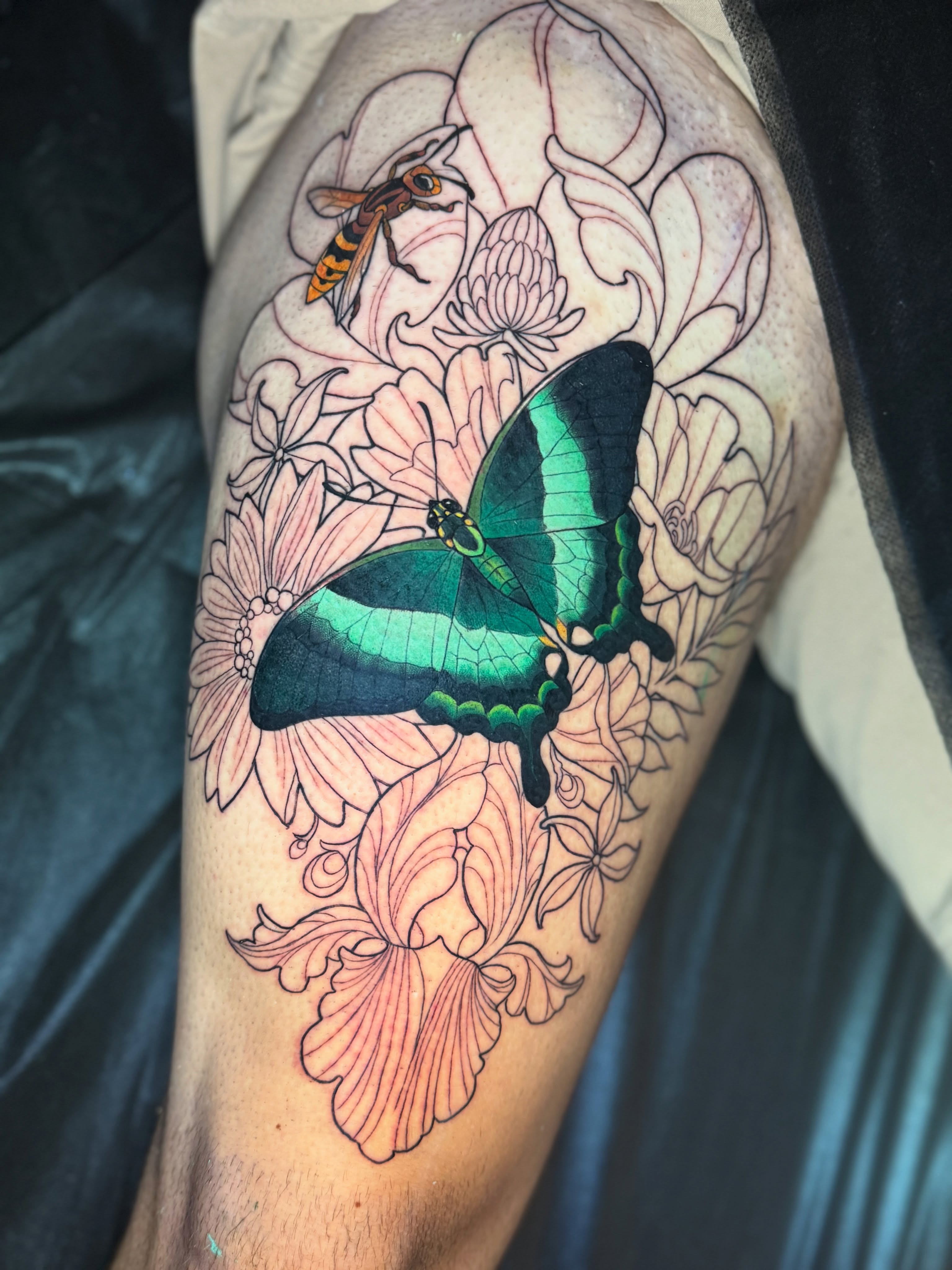Butterfly and flowers new school tattoo on the thigh by Andi Fitz ✨ San Diego Tattoo Artist, San Diego, California