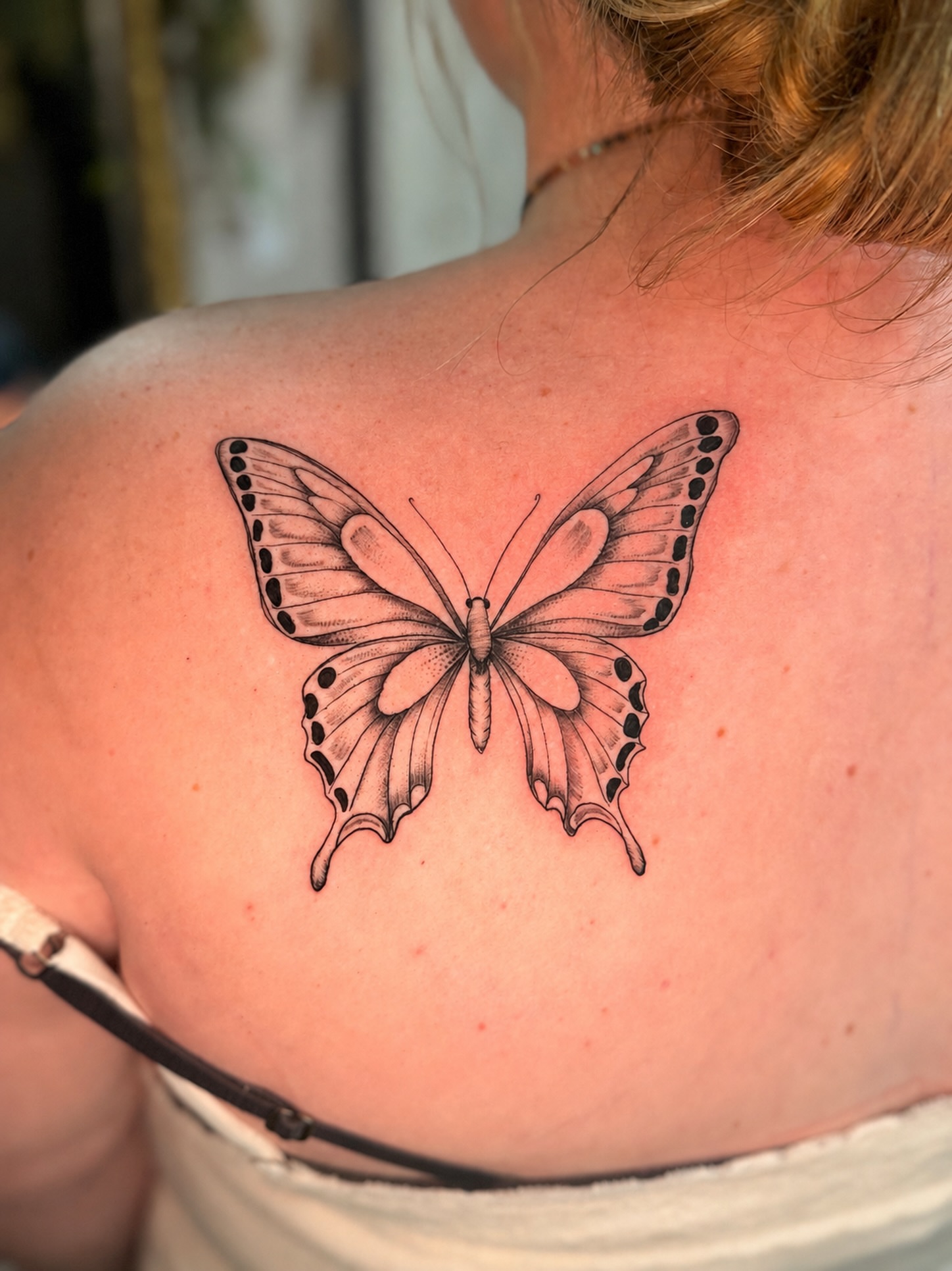 Butterfly black and grey tattoo on the shoulder by JAmy Winters