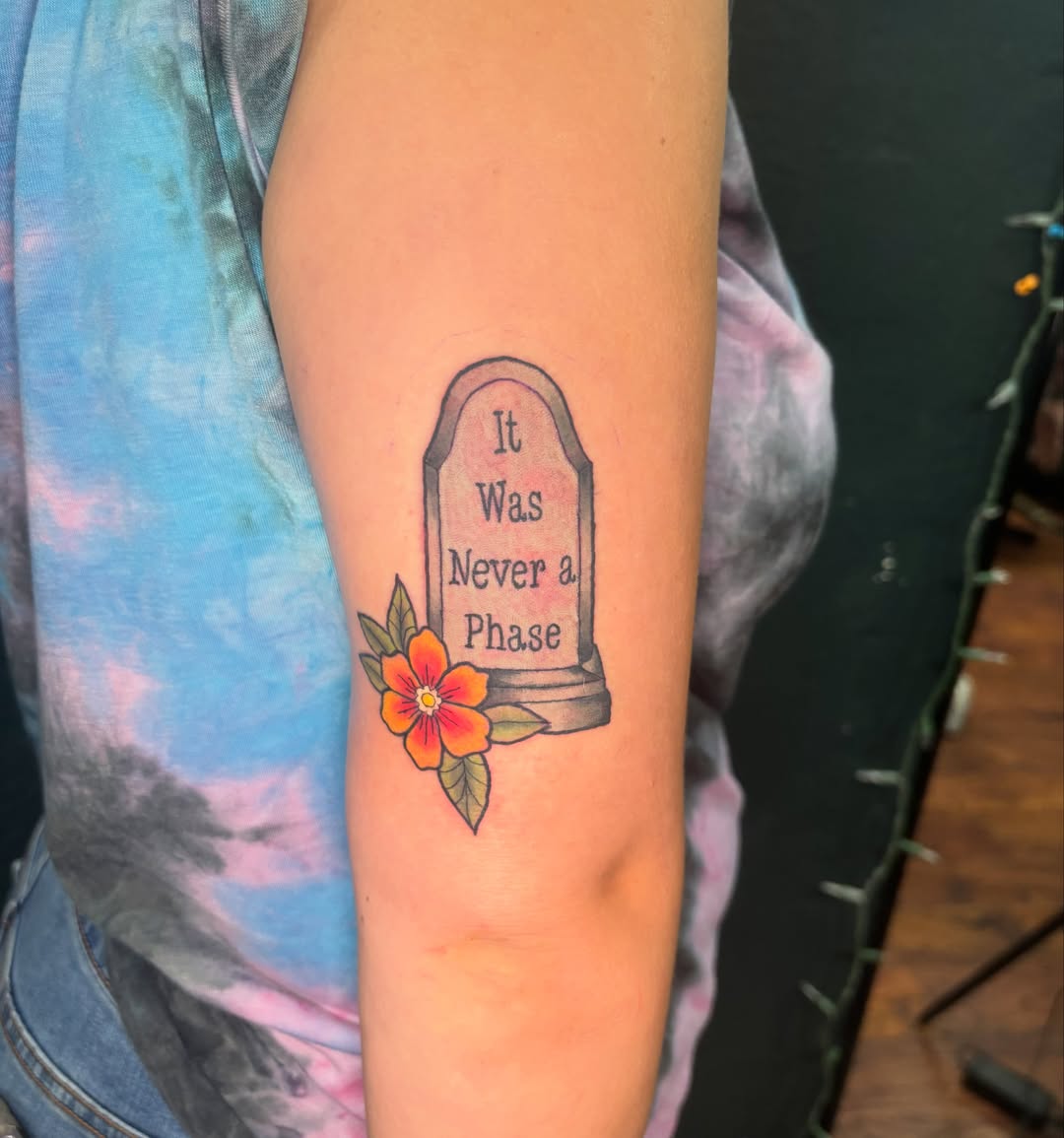 Grave marker with flower dotwork tattoo on the forearm by Emma ๐