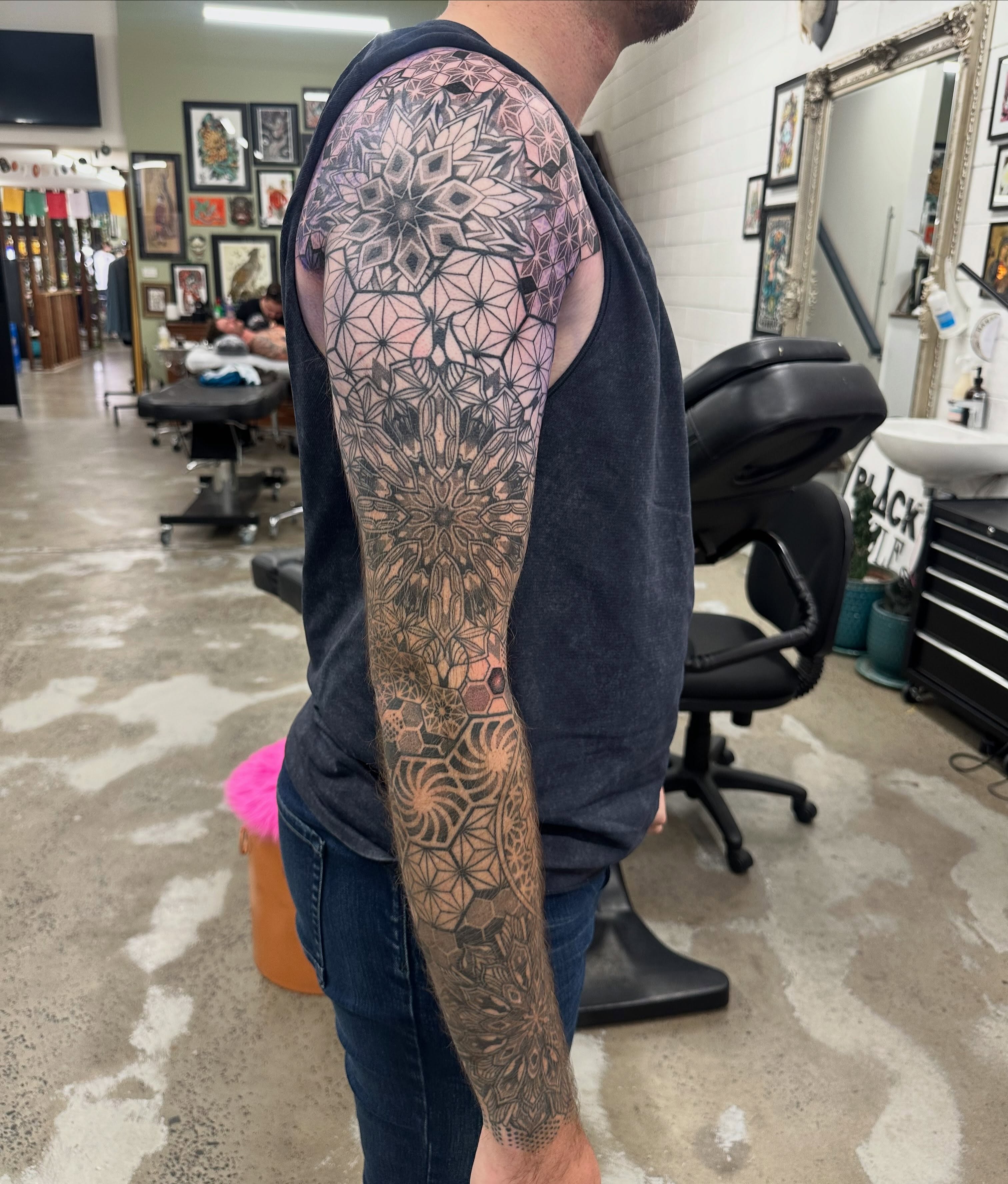 Geometric mandala geometric tattoo on the upper arm by Lyndsay Southgate