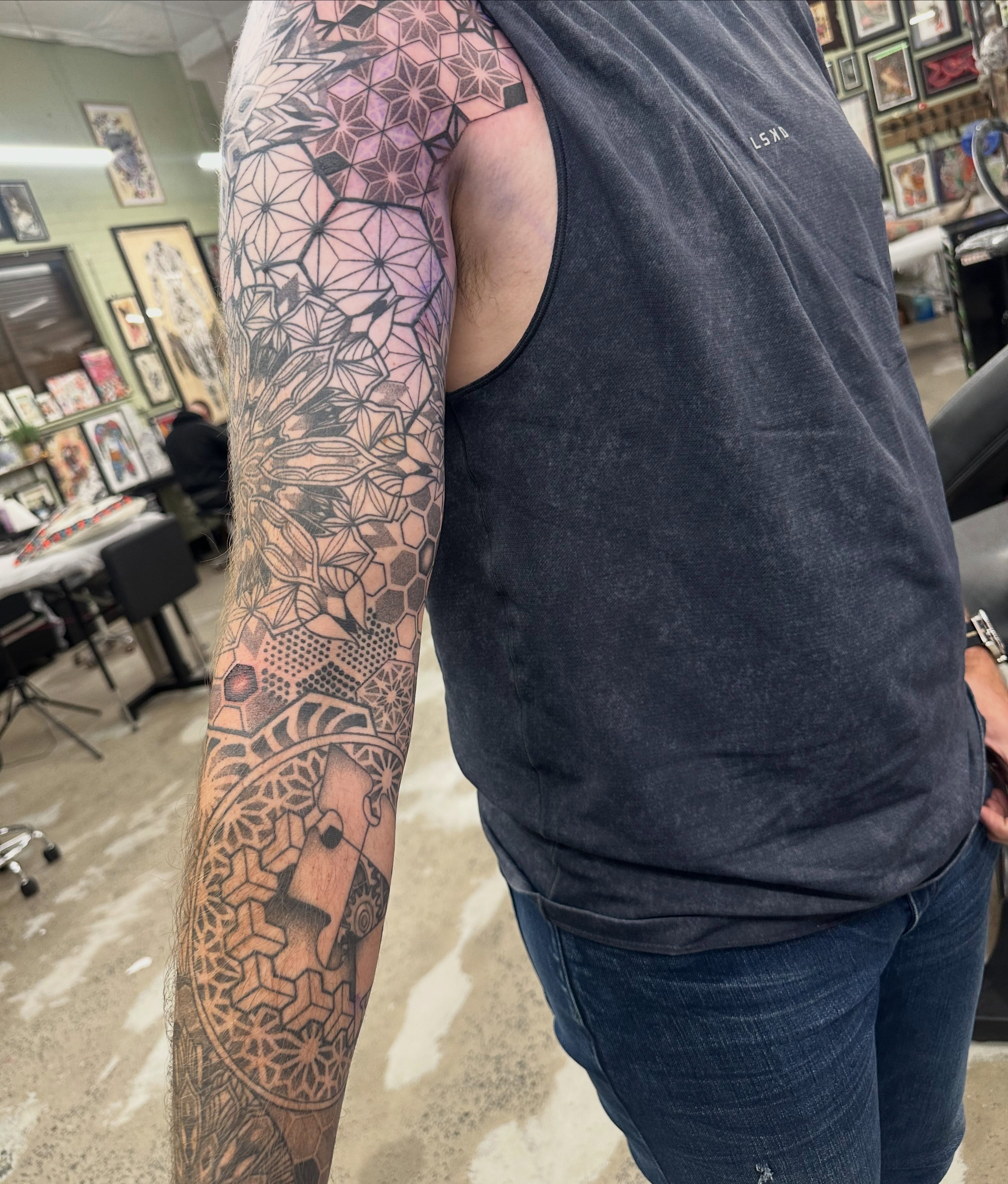 Geometric mandala geometric tattoo on the upper arm by Lyndsay Southgate