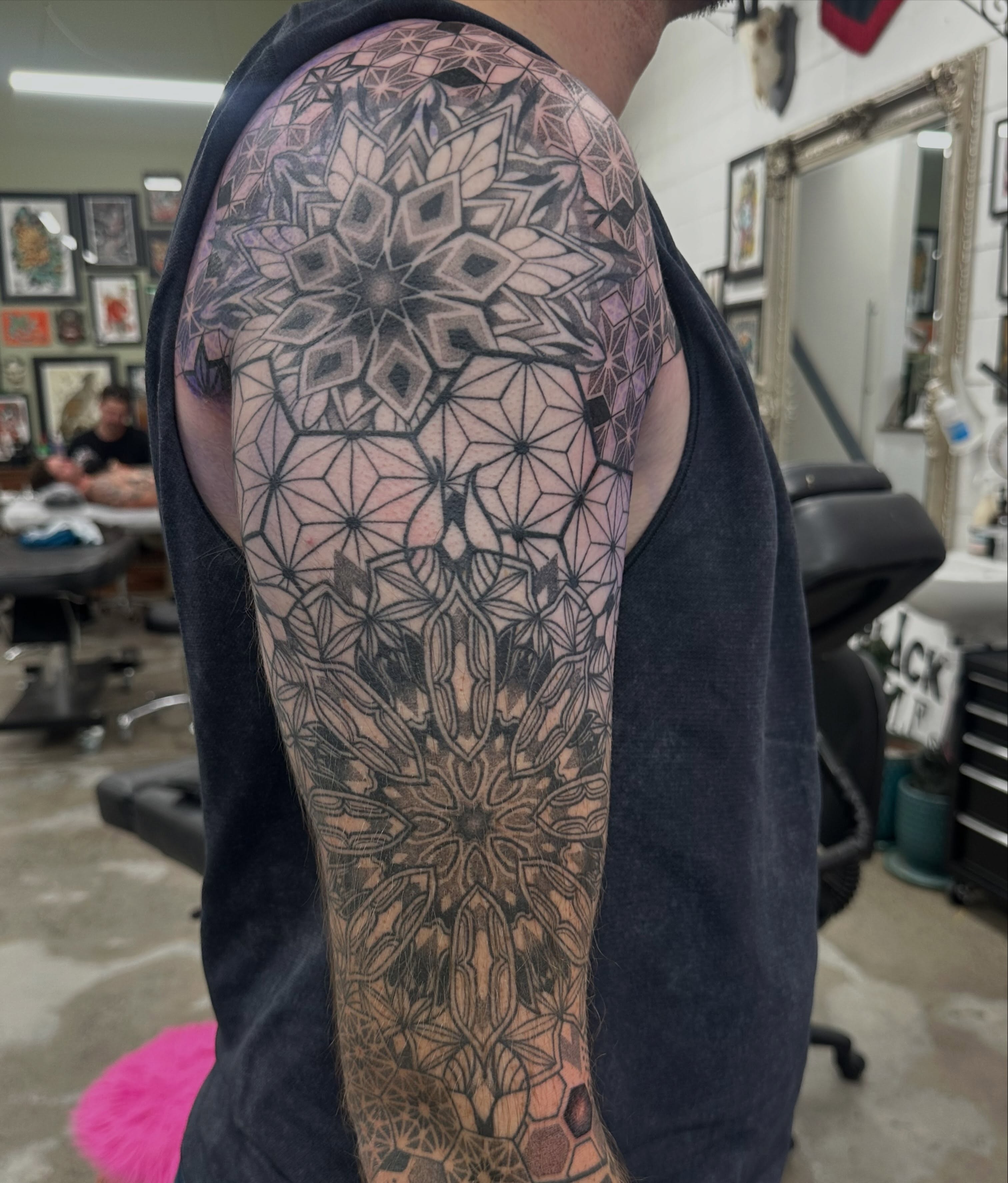 Geometric mandala geometric tattoo on the upper arm by Lyndsay Southgate