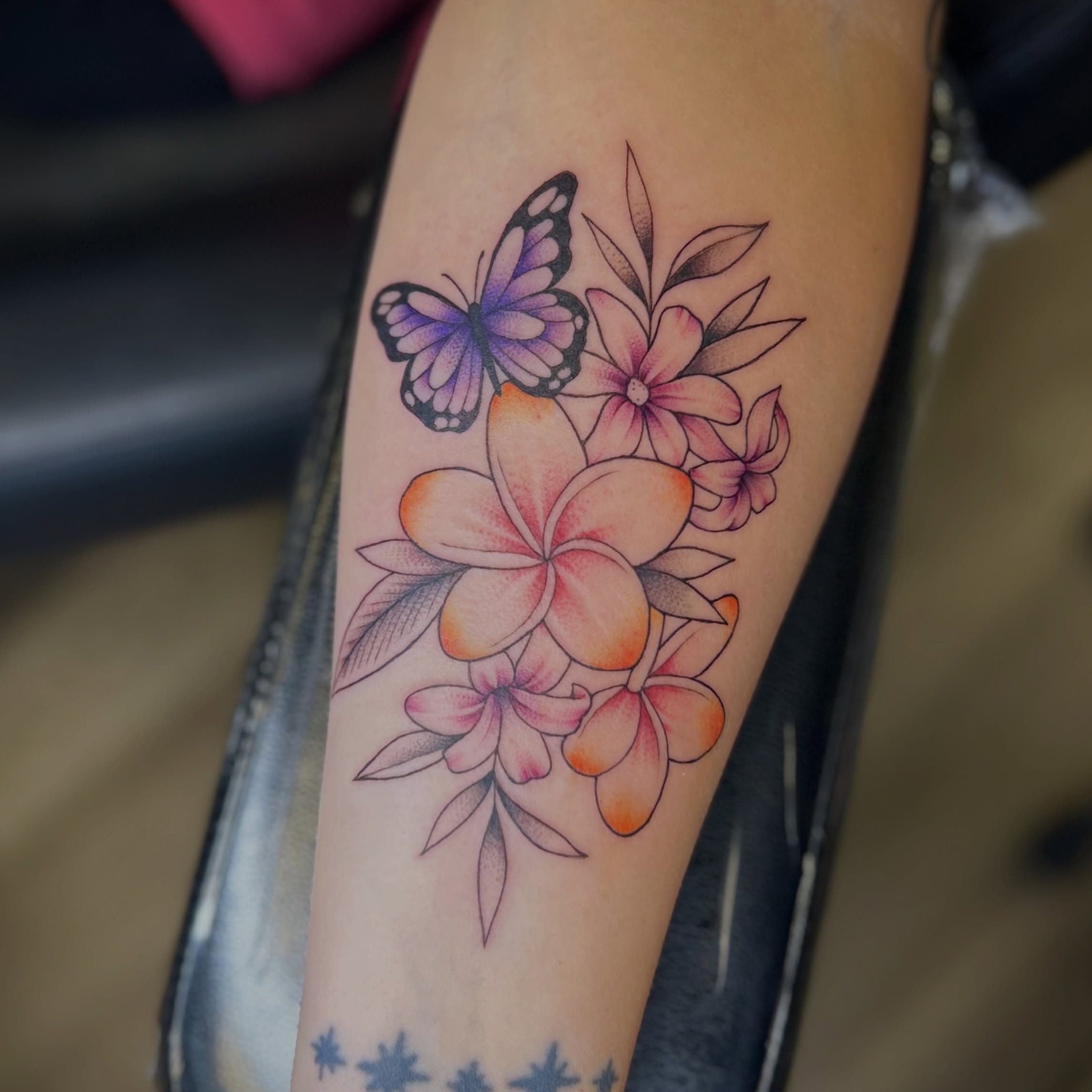 Butterfly and flowers dotwork tattoo on the forearm by Browtique & Ink, Clearwater, Florida