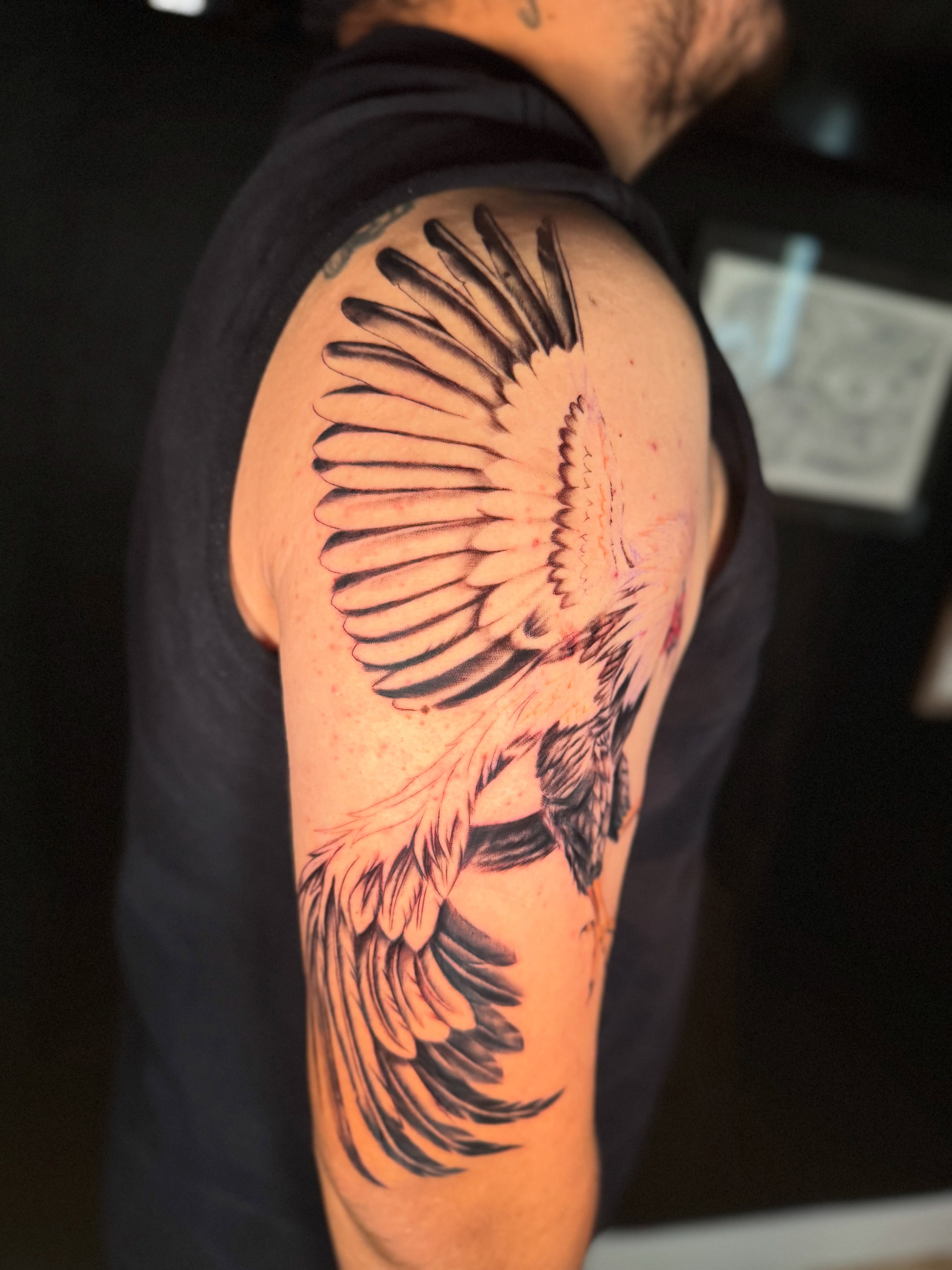 Phoenix black and grey tattoo on the shoulder by Monica Gonzalez