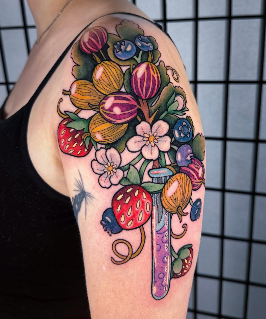Fruit bouquet new school tattoo on the upper arm by rocky love