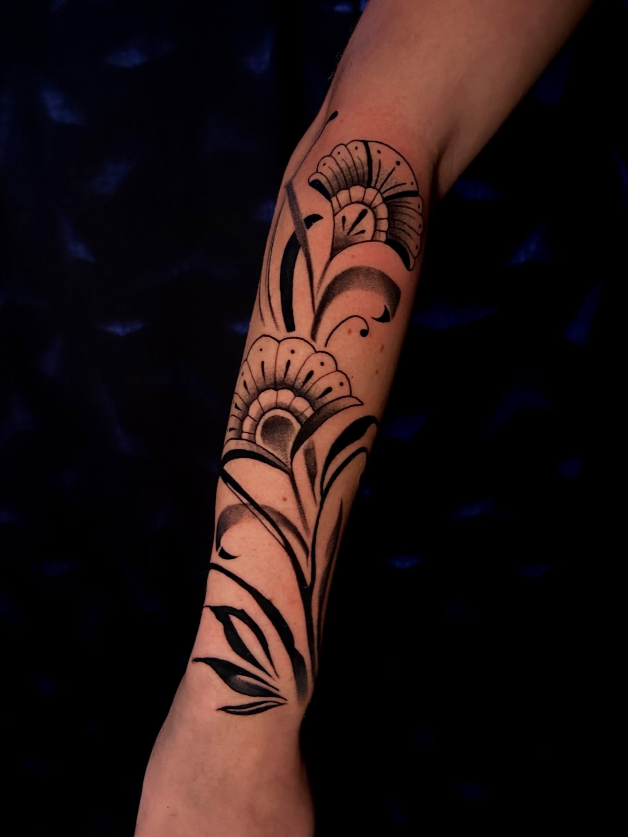Floral design black and grey tattoo on the forearm by Haleigh Cunningham, Charlotte, North Carolina