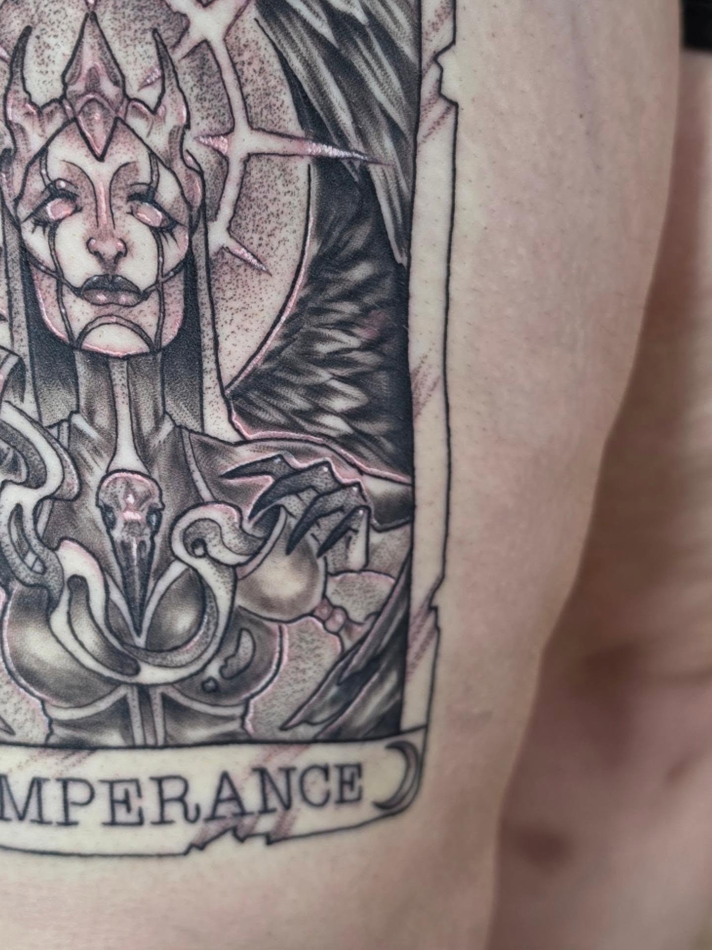Temperance card black and grey tattoo on the thigh by Colleen