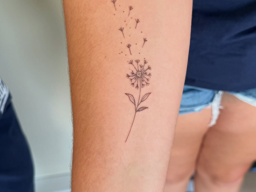 Dandelion dotwork tattoo on the forearm by Fineline Tattoo