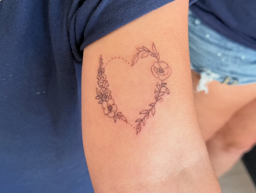 Floral wreath dotwork tattoo on the forearm by Fineline Tattoo