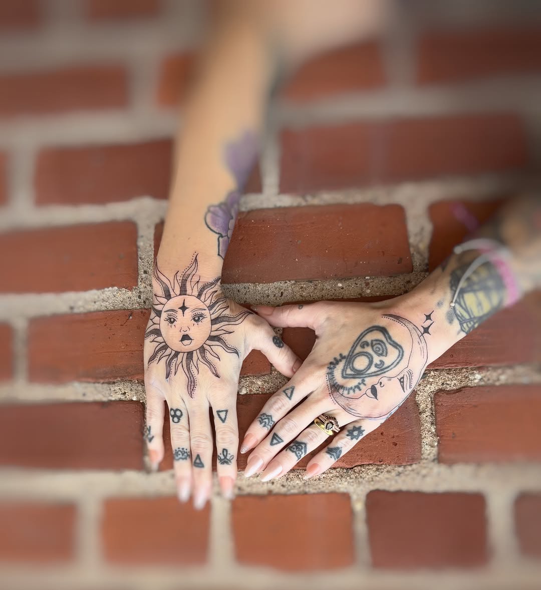 Sun and moon geometric tattoo on the hand by Holly