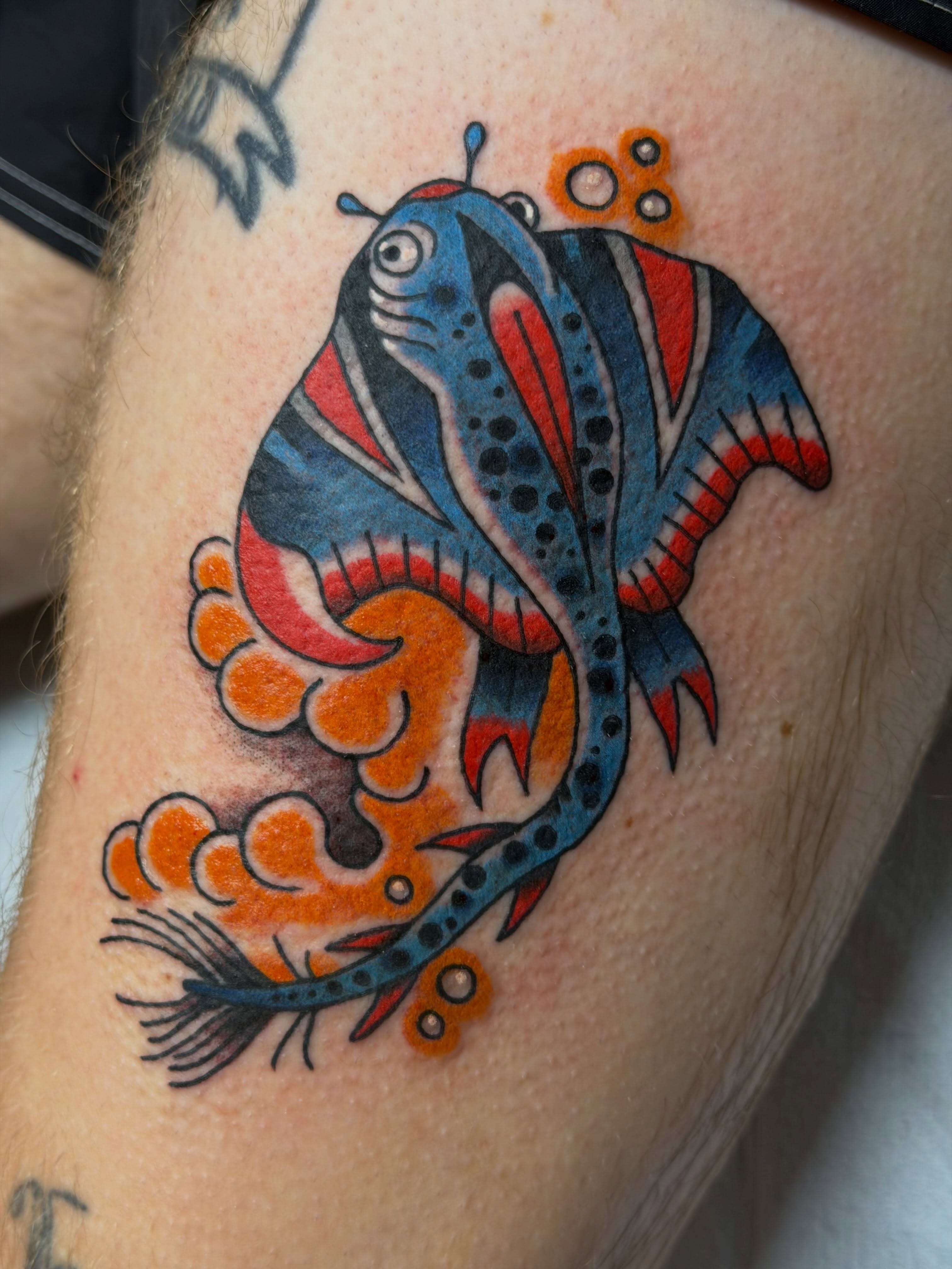 Fish American traditional tattoo on the forearm by Gerald Bellmore