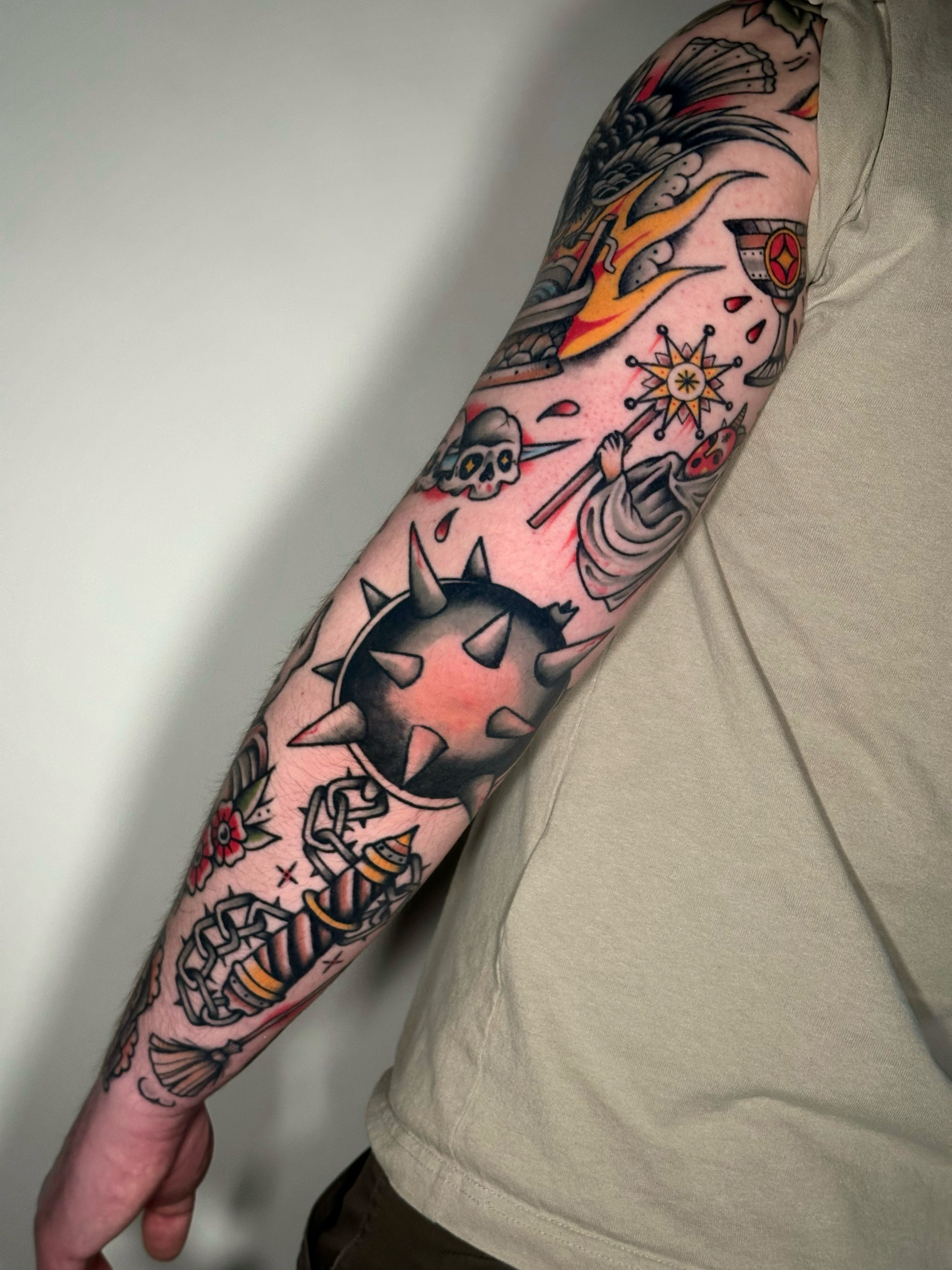 Manga-inspired sleeve American traditional tattoo on the forearm by Black and color tattoo!