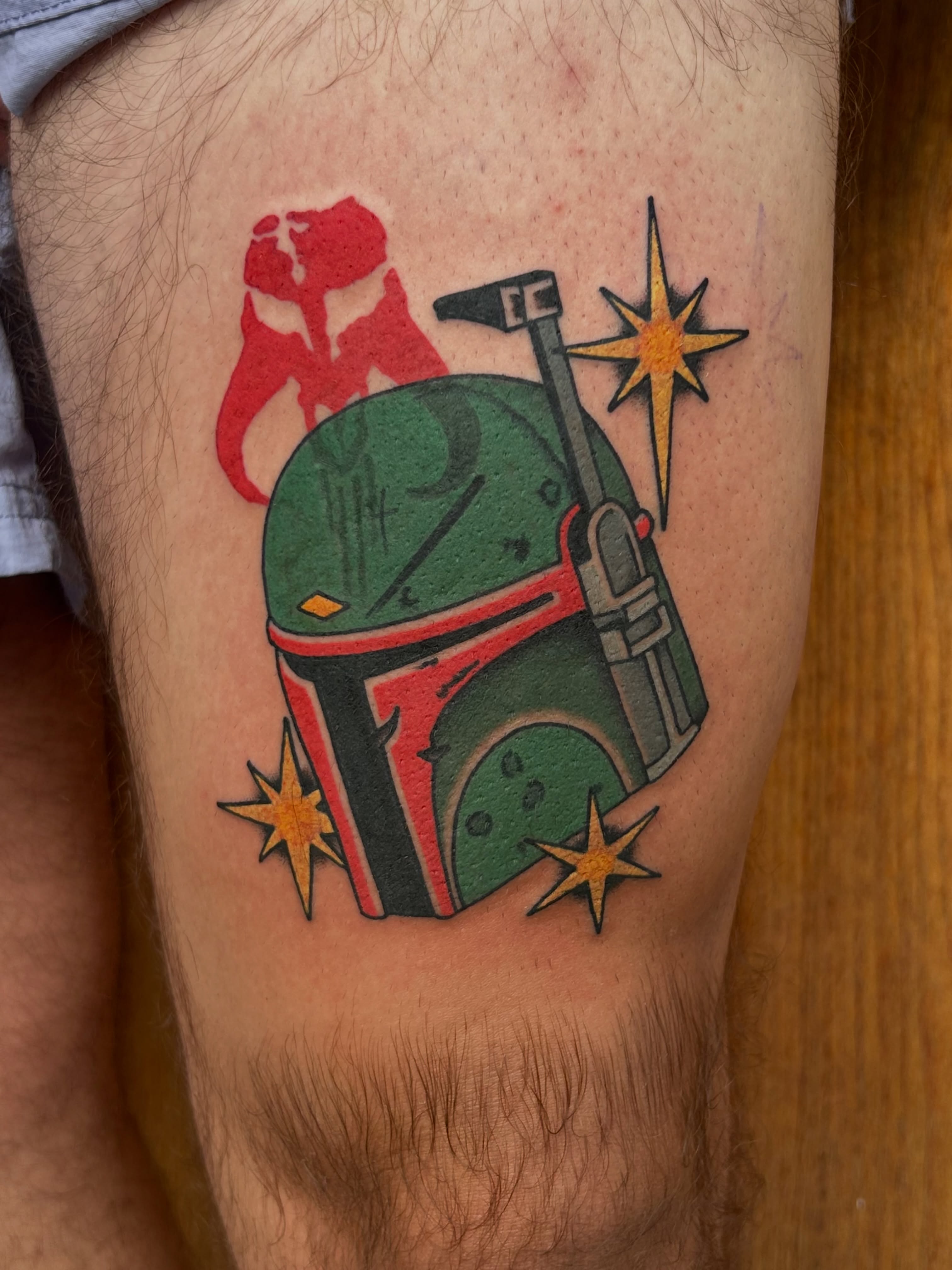 Boba Fett helmet American traditional tattoo on the thigh by Lauren Alexandra