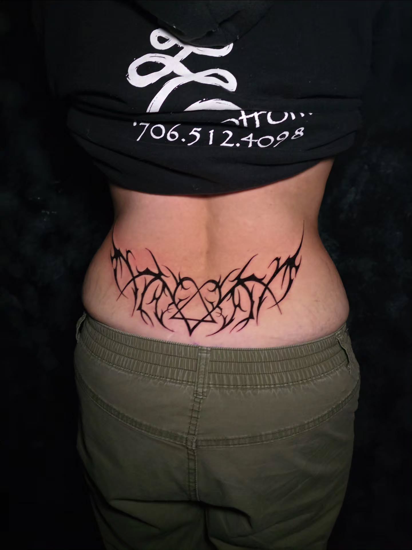 Tribal tribal tattoo on the torso by Ashley Johnson, Knoxville, Tennessee