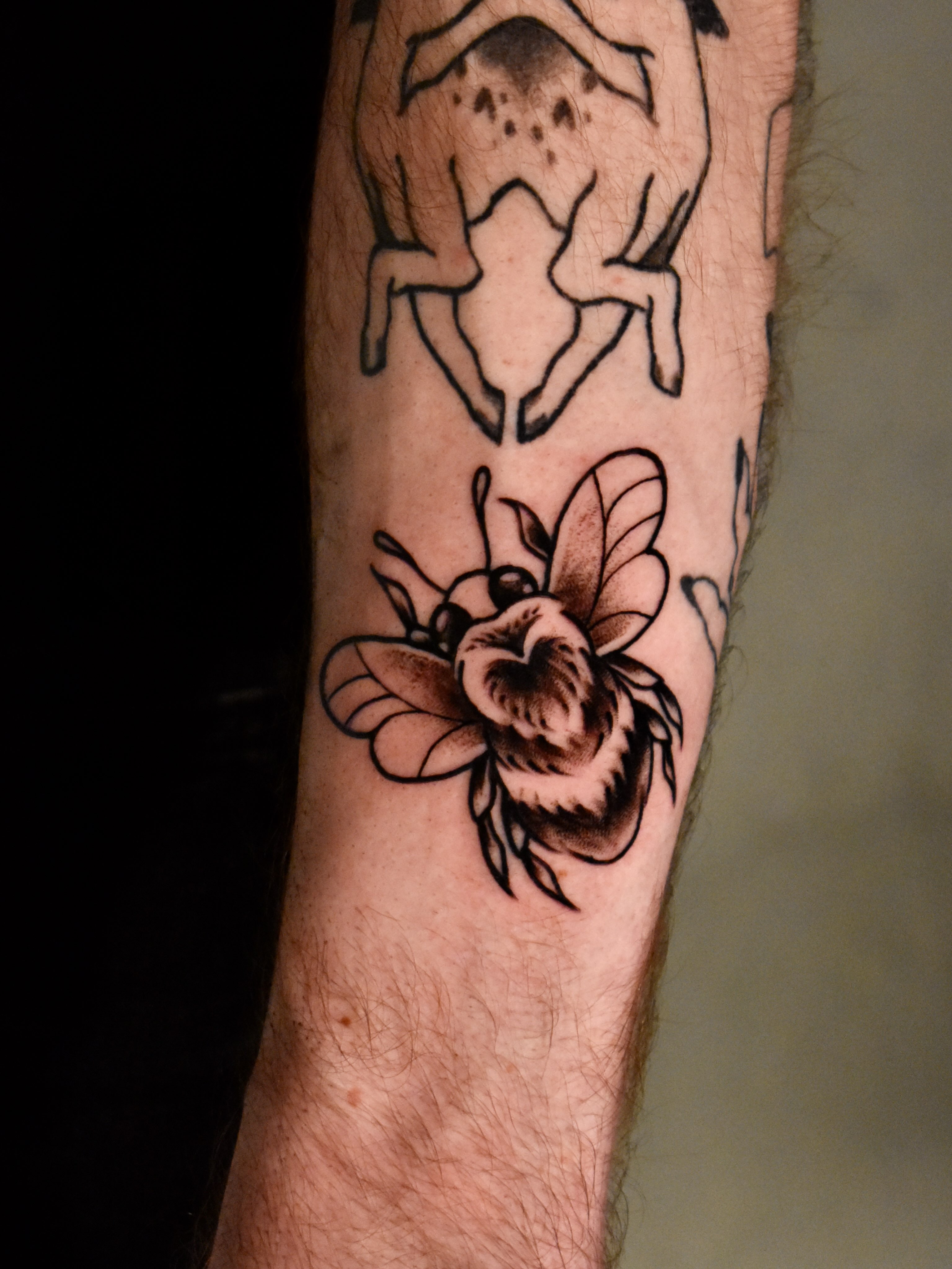 Bee American traditional tattoo on the forearm by Mackz