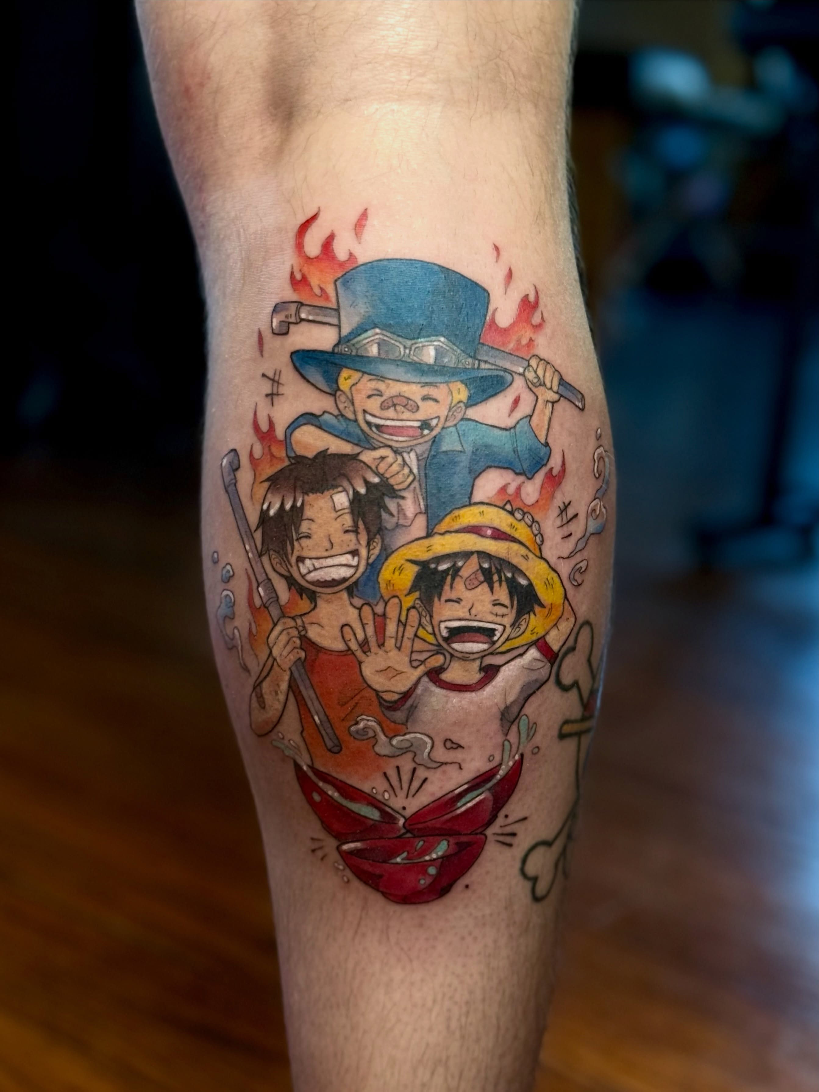 Anime characters anime tattoo on the forearm by Jynx