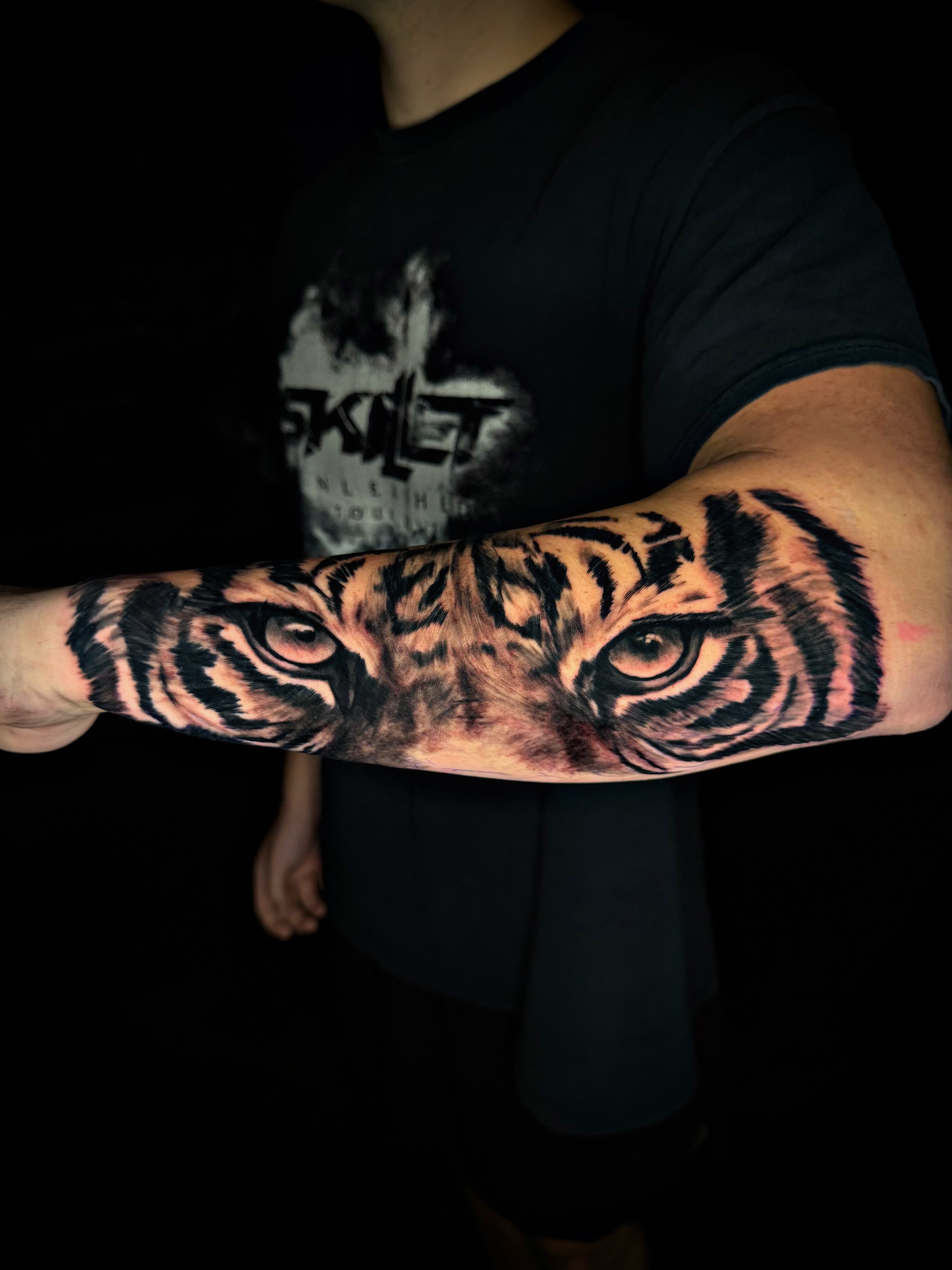 Tiger eyes realism tattoo on the forearm by Dallas Tattoo Artist📍